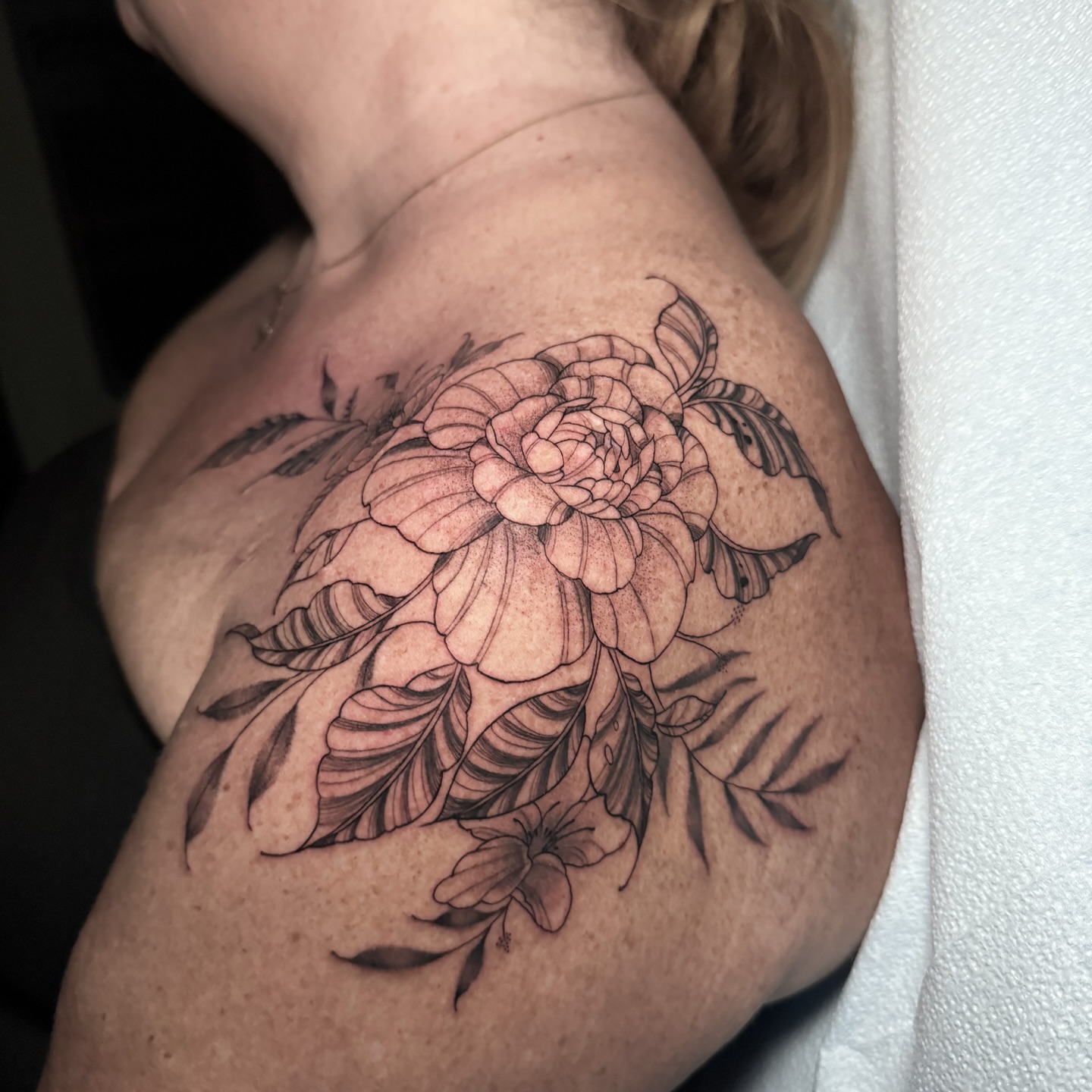 Peony flower black and grey tattoo on the shoulder by 𝕹𝖆𝖙