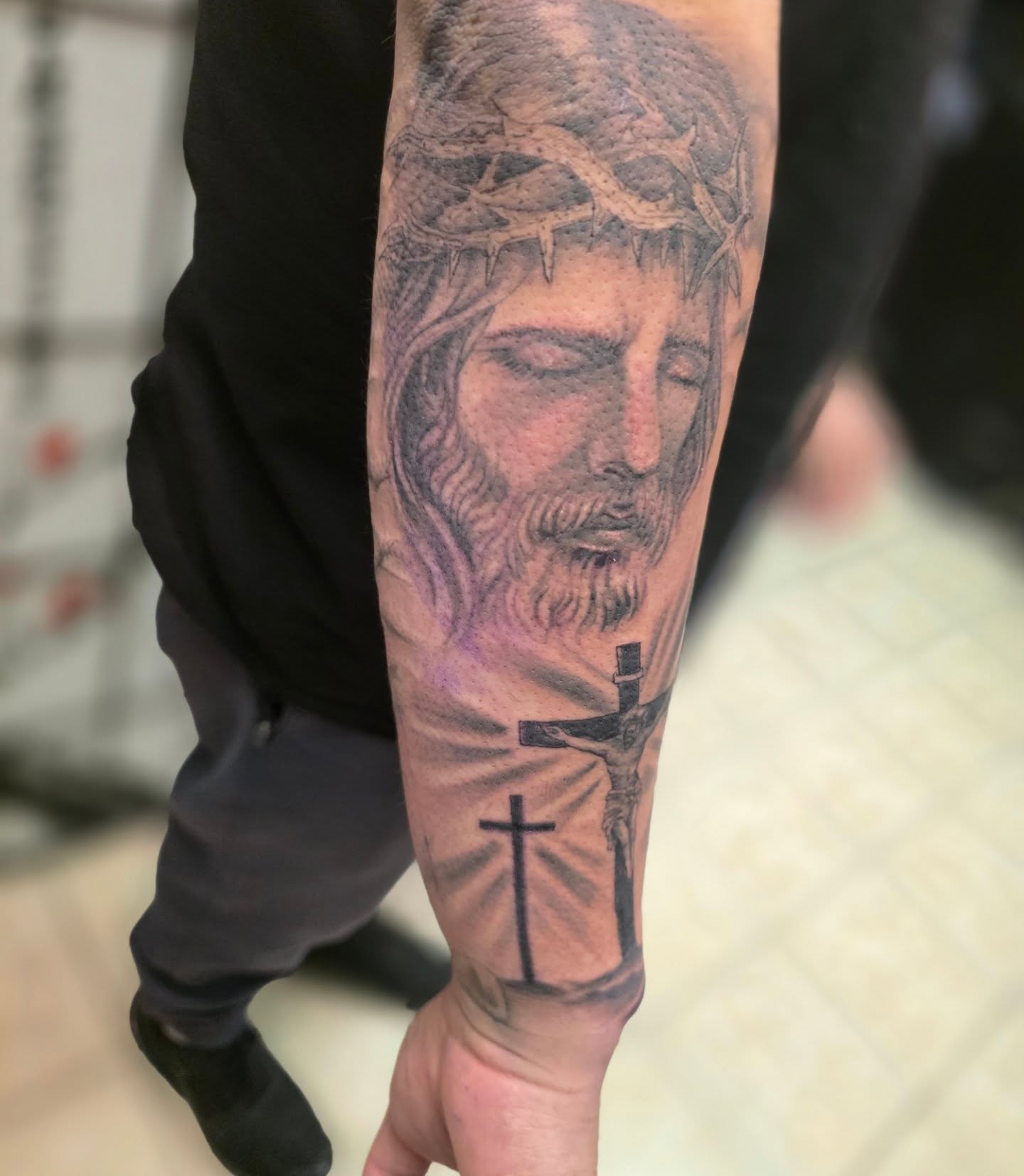 Jesus Christ realism tattoo on the forearm by Claudia Isabel Roman, El Paso, Texas