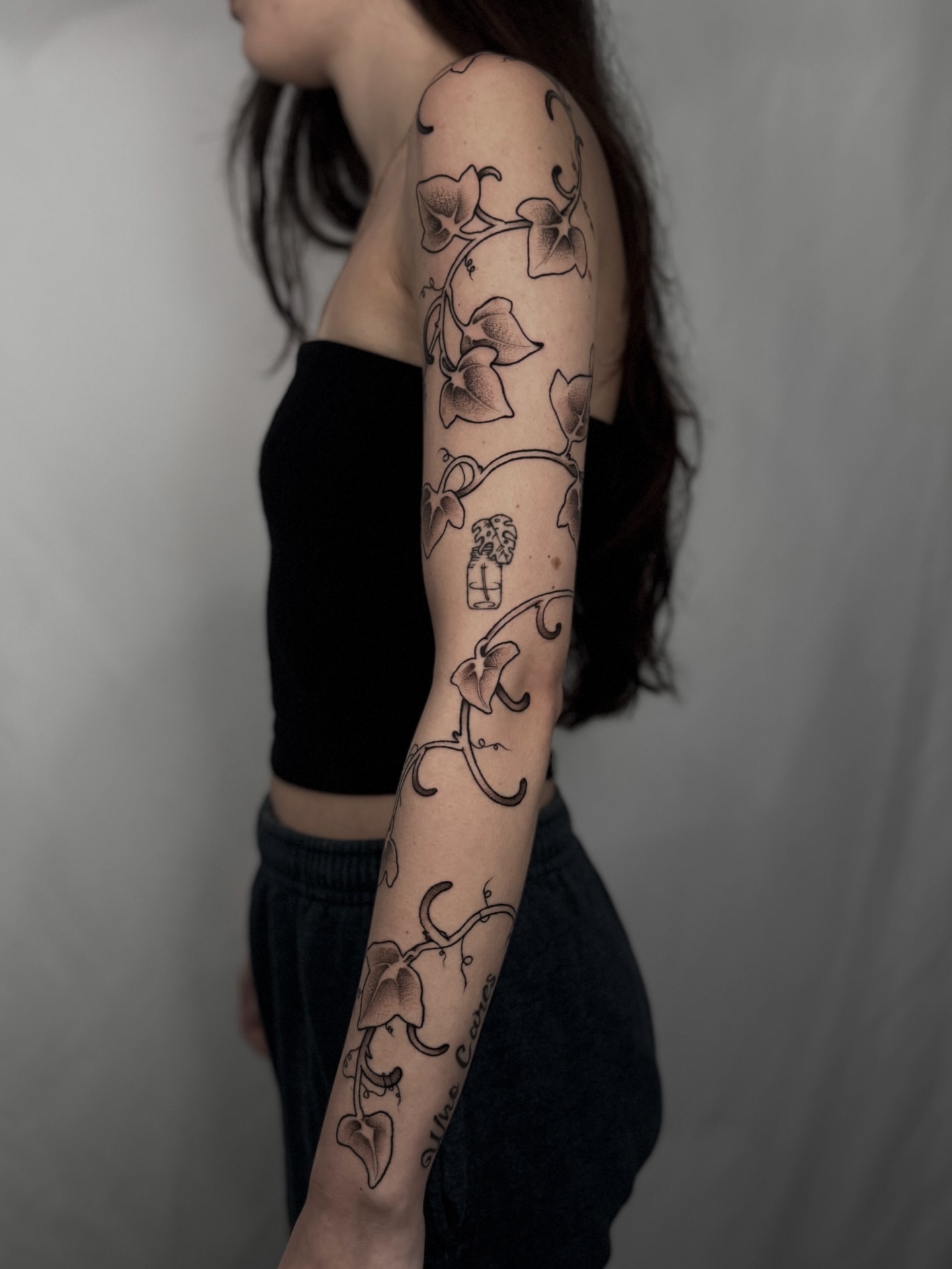 Vines and flowers black and grey tattoo on the upper arm by Ally Ghastly, Eugene, Oregon