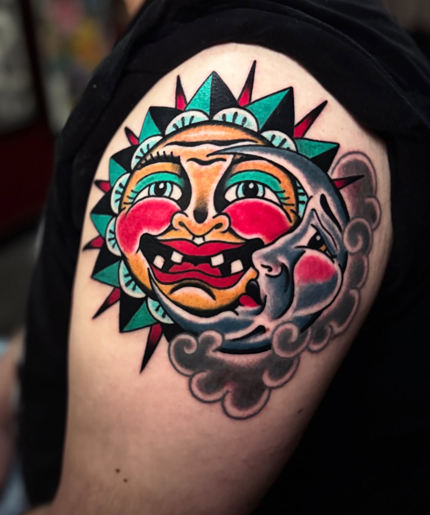 Sun and moon American traditional tattoo on the shoulder by Bre