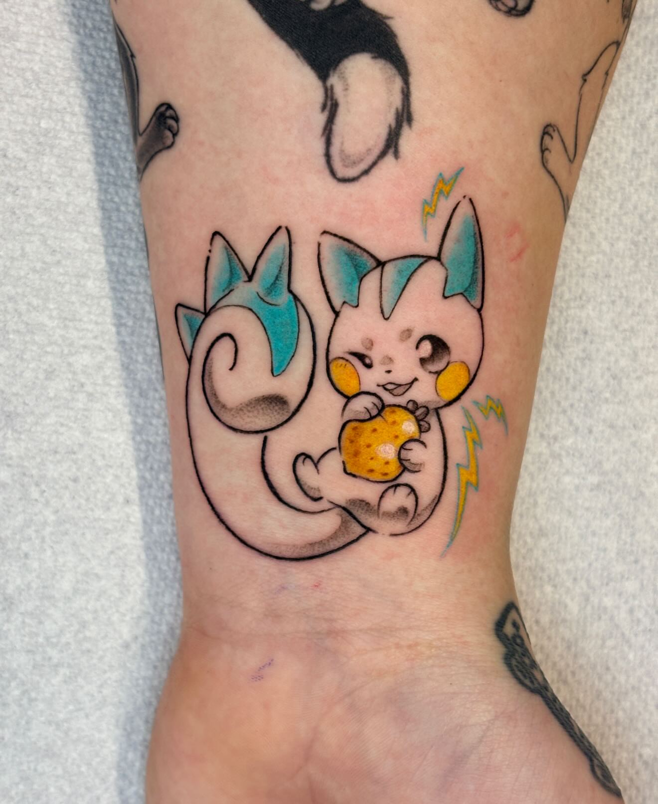 Chibi cat new school tattoo on the forearm by jo, Wichita, Kansas