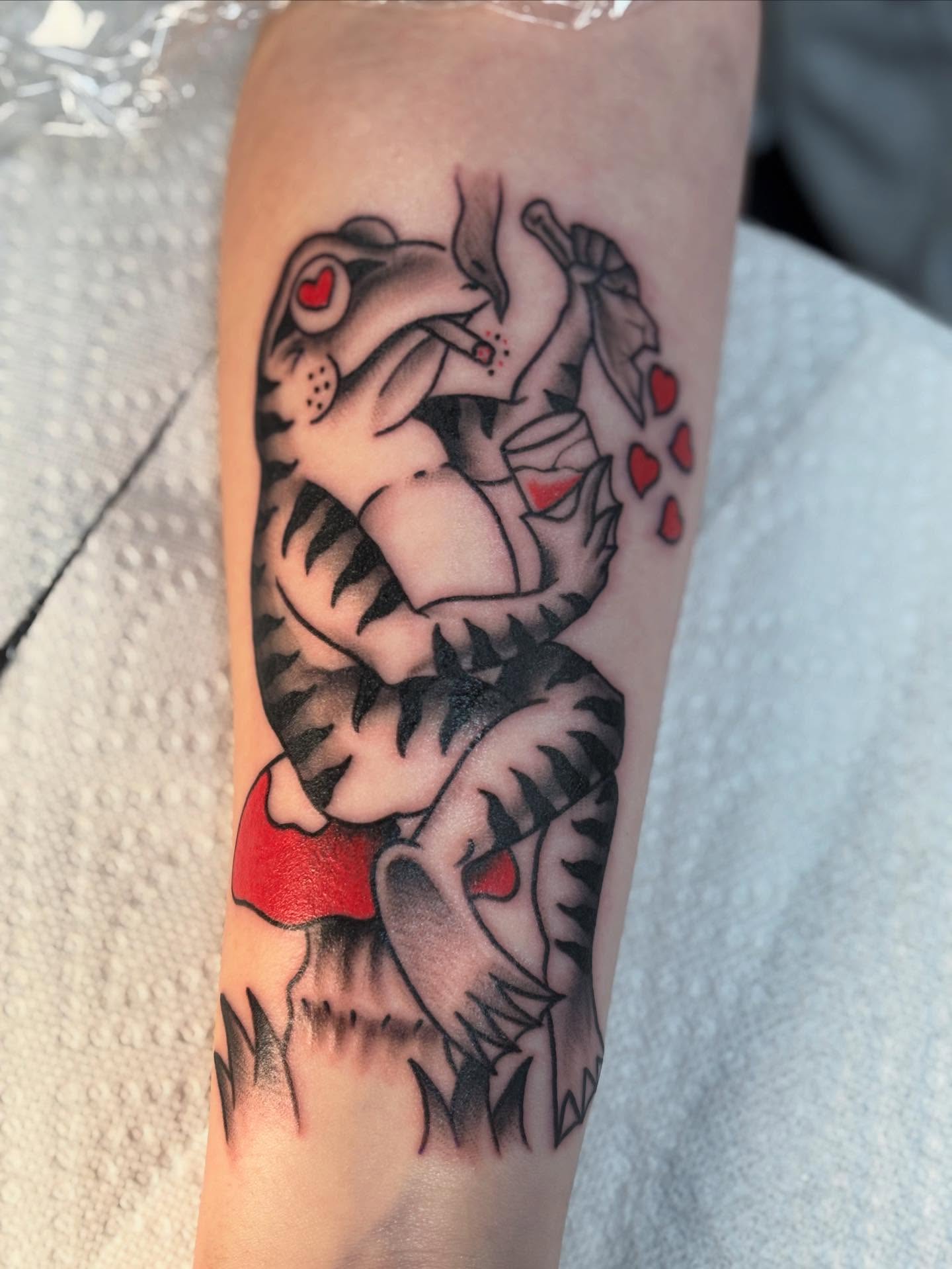 Tiger and heart American traditional tattoo on the forearm by Nick Tate