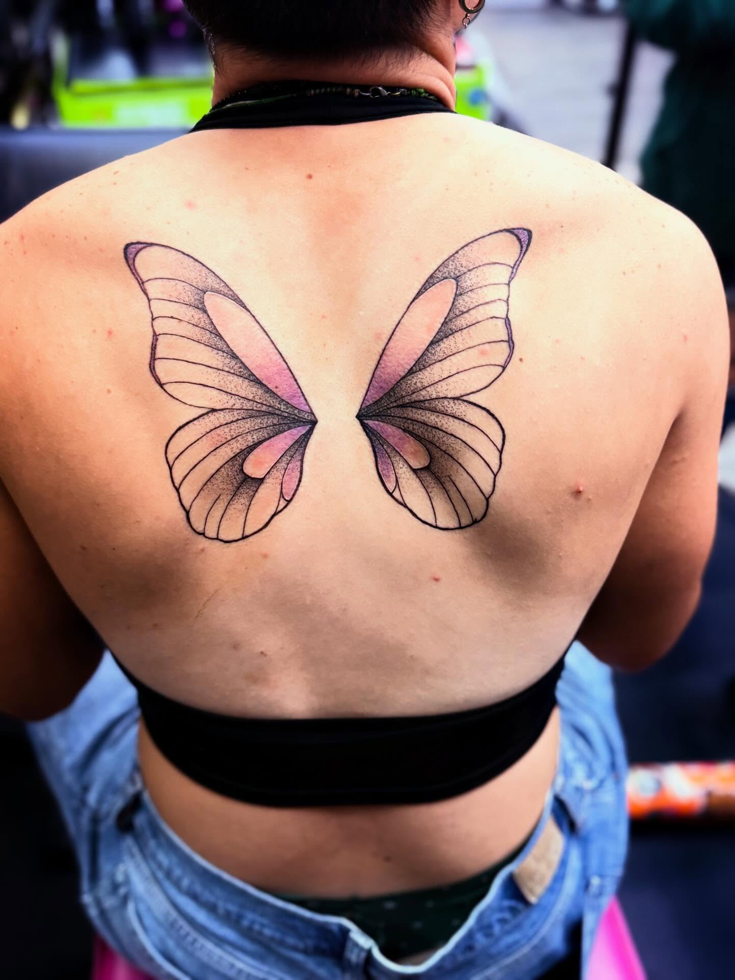 Butterfly dotwork tattoo on the back by Nicholas A. Estes-Davis
