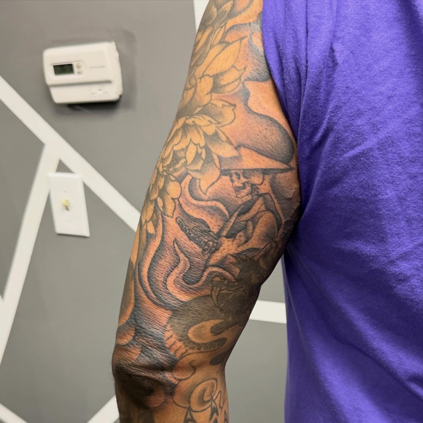 Jazz musician with saxophone American traditional tattoo on the forearm by Katie Rojas