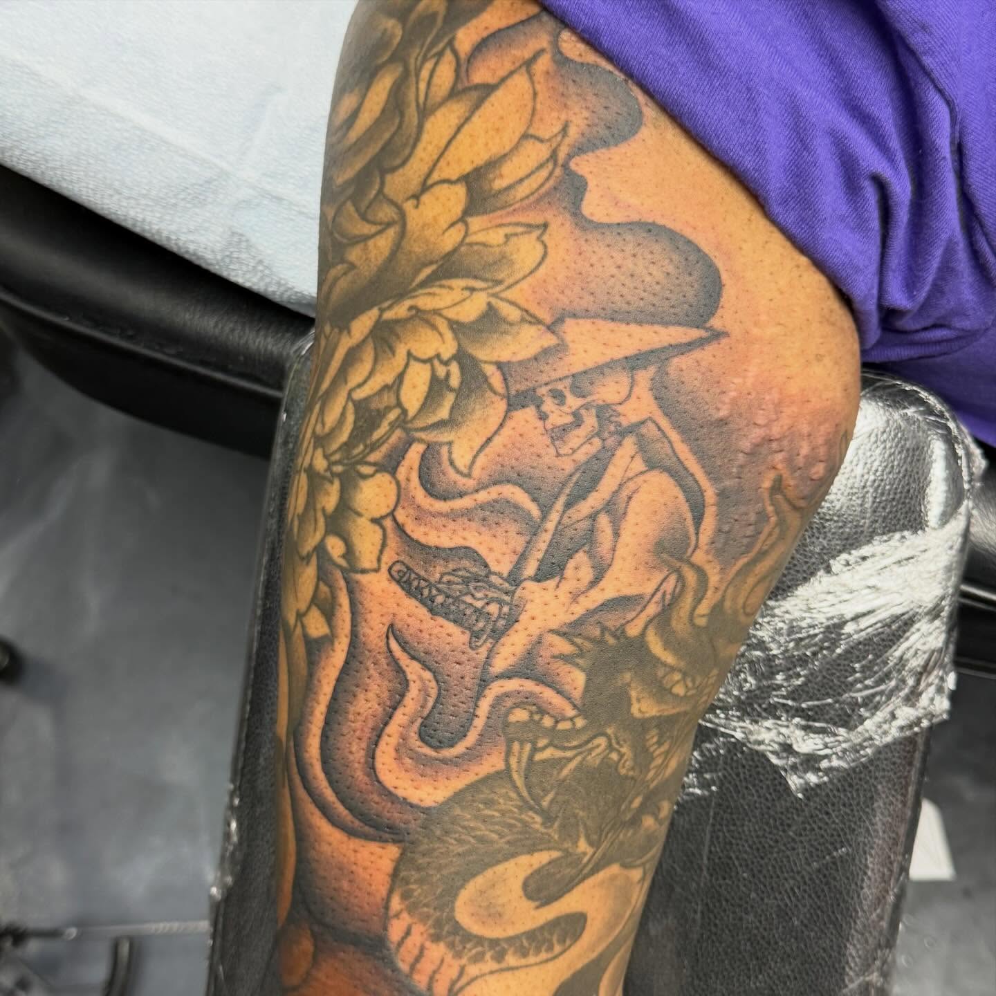 Snake and skull American traditional tattoo on the thigh by Katie Rojas