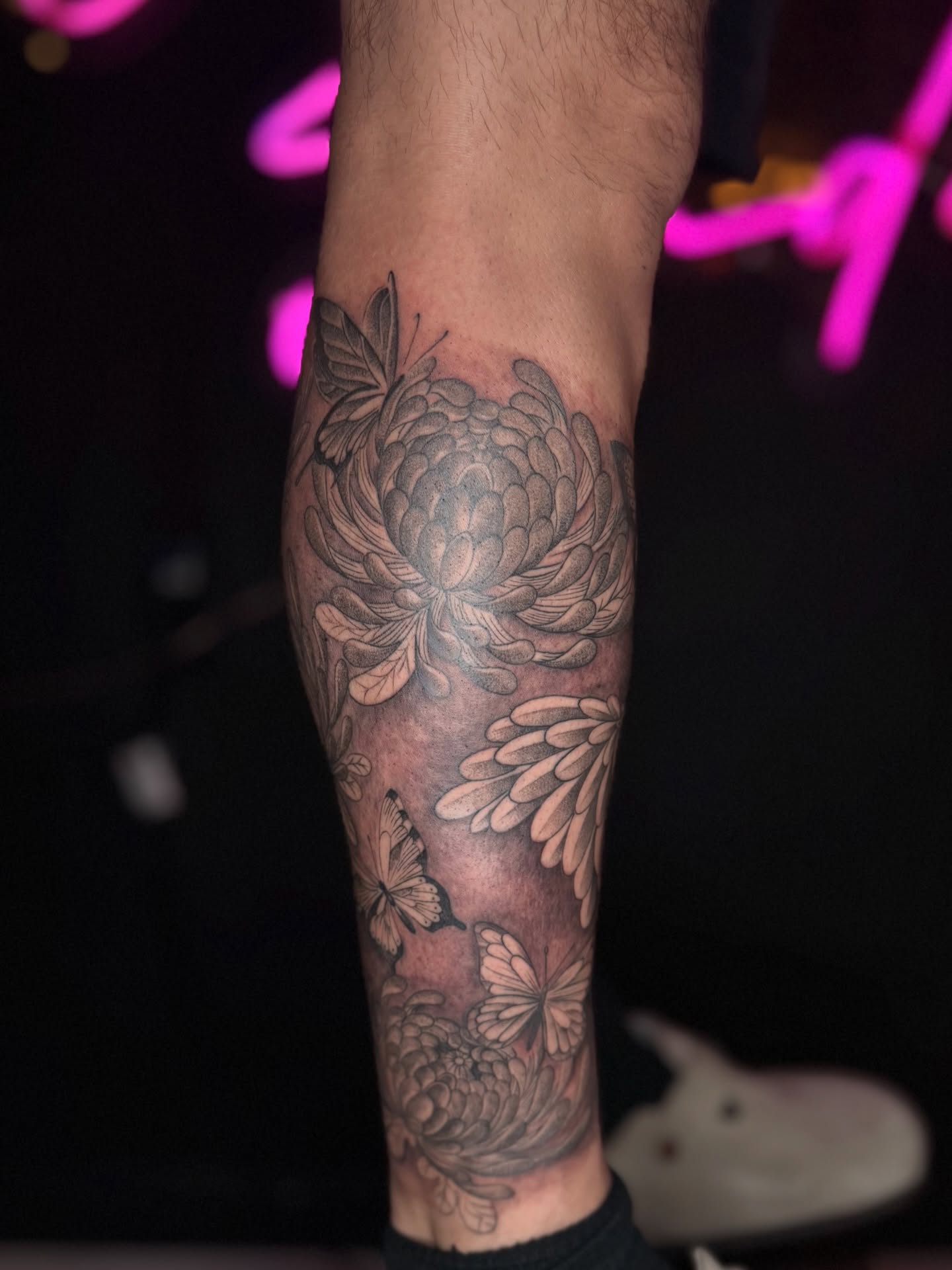 Chrysanthemum and butterflies realism tattoo on the forearm by B o n d B o n d , “ a r t i s t “