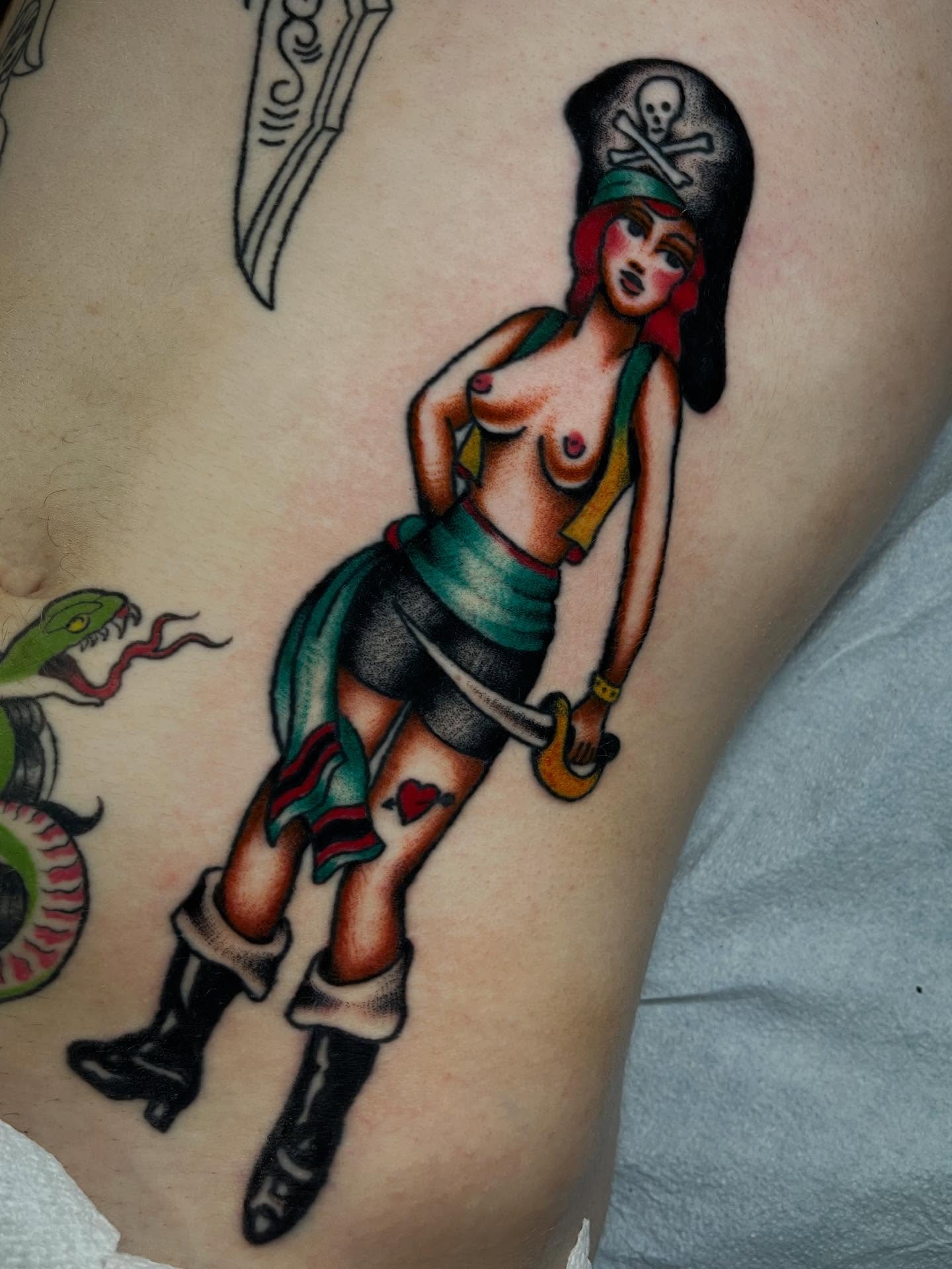 Pirate woman American traditional tattoo on the thigh by Marqui Watling