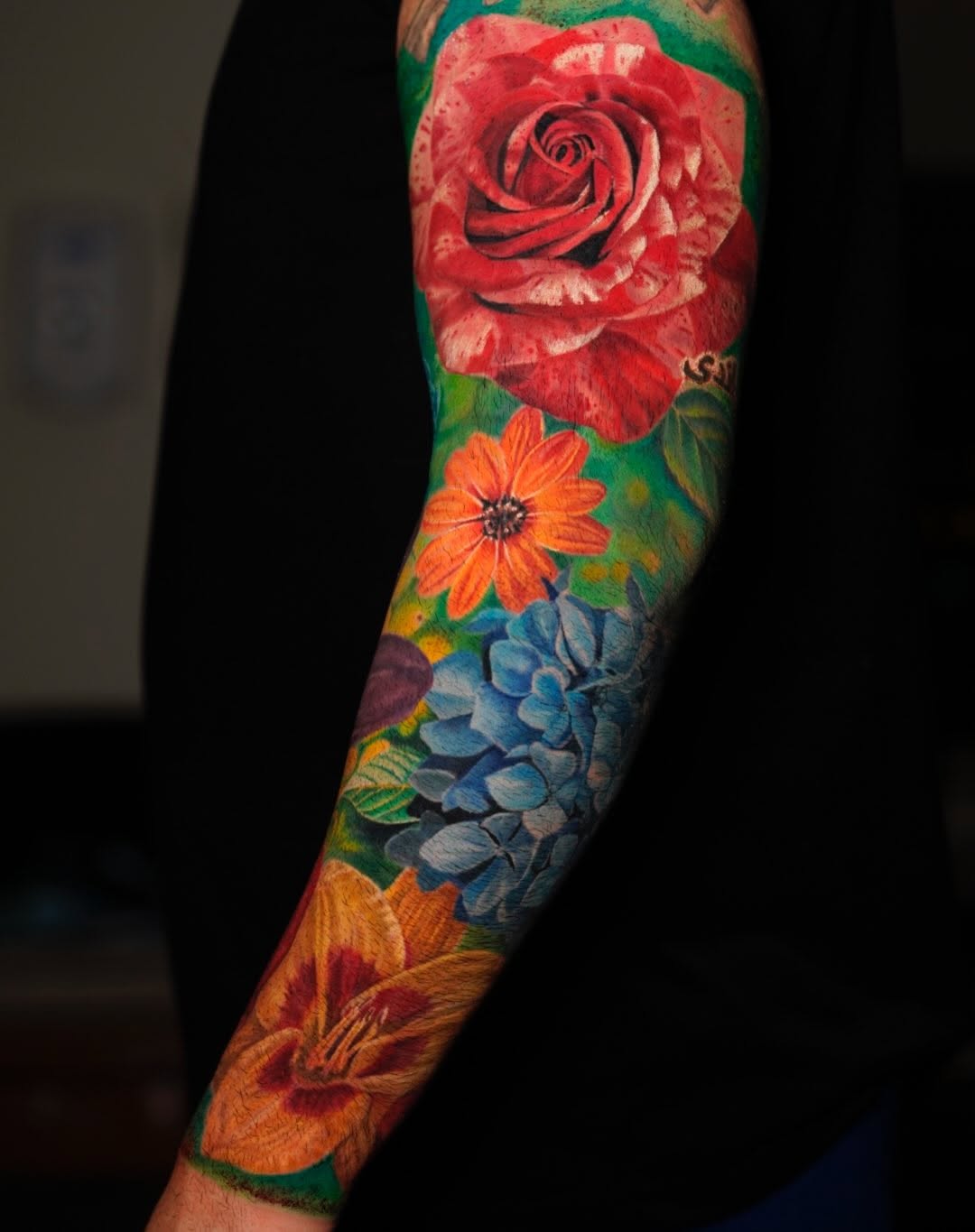 Floral sleeve neo-traditional tattoo on the forearm by David Gordon