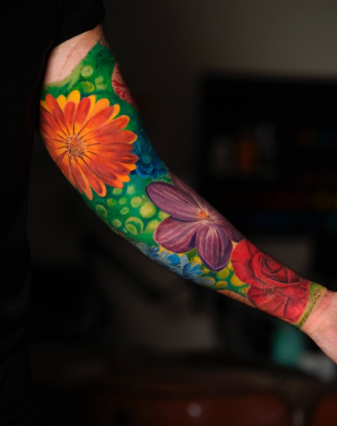 Floral sleeve neo-traditional tattoo on the forearm by David Gordon