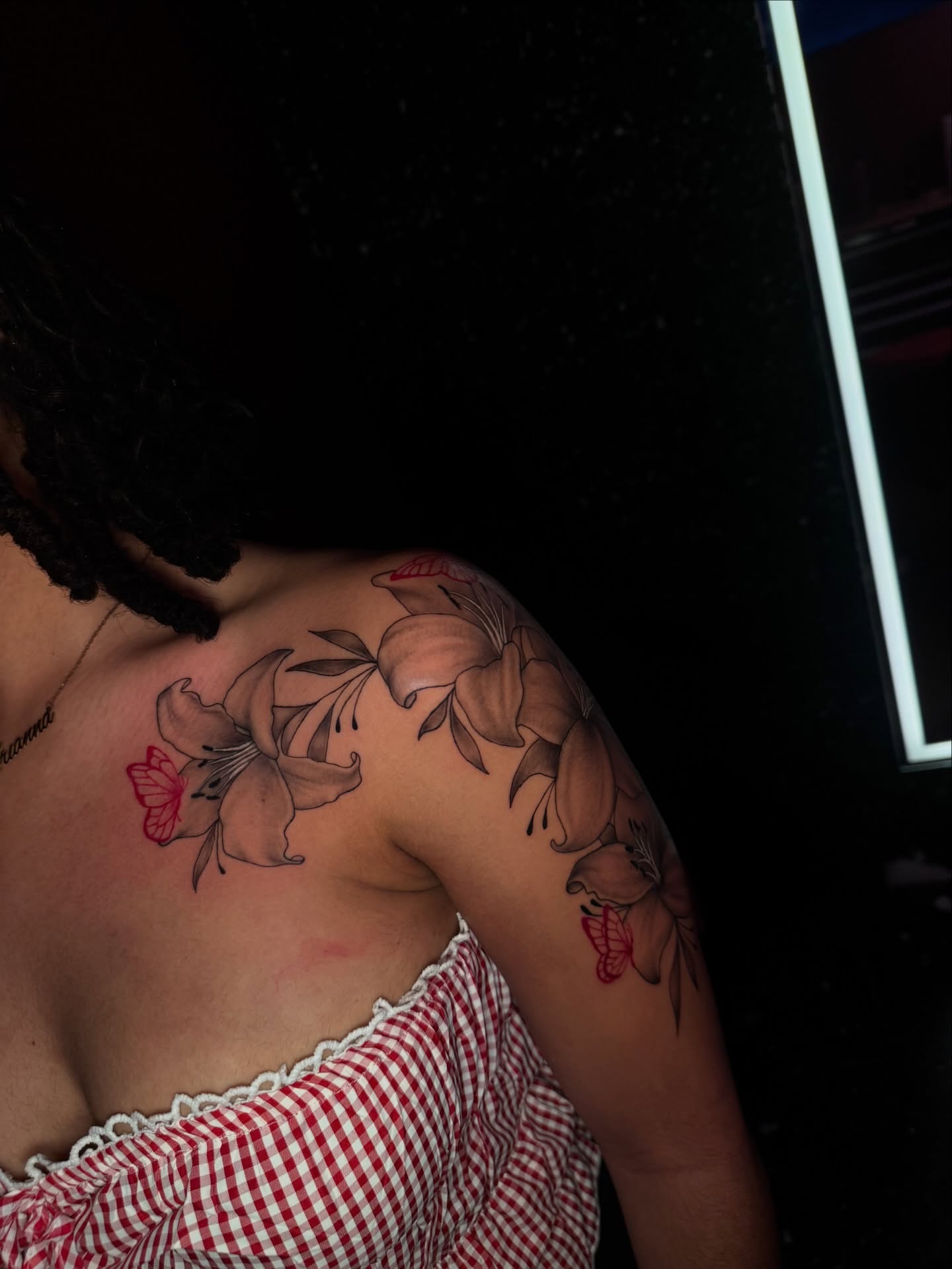 Lilies and butterfly black and grey tattoo on the shoulder by Austin Tattoo Artist💉
