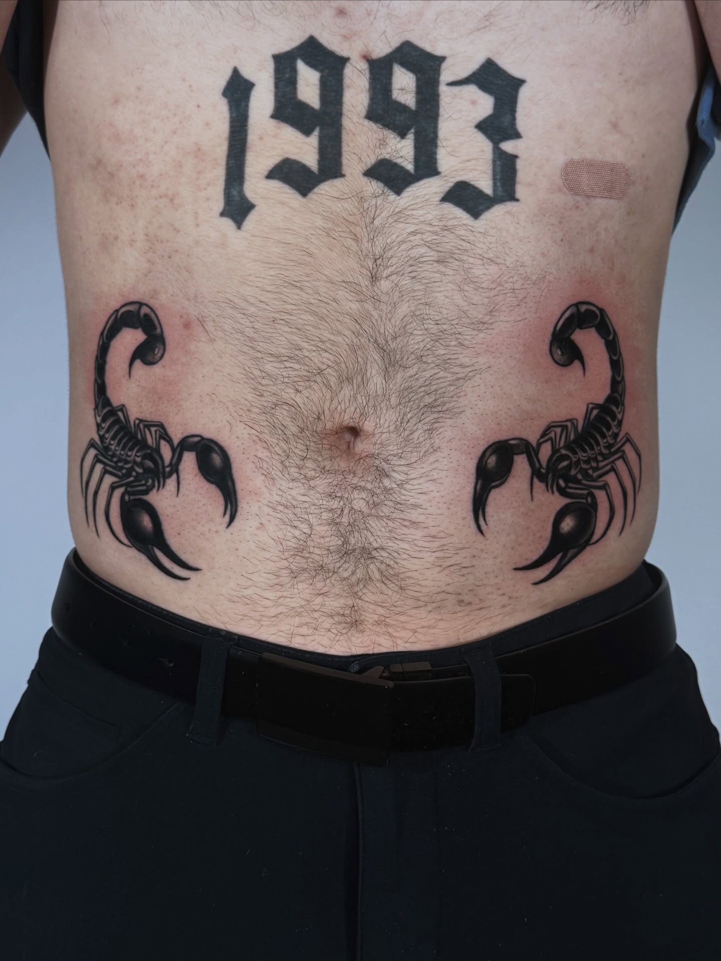 Scorpions and year black and grey tattoo on the chest by Tattoos.byDahlia, Austin, Texas