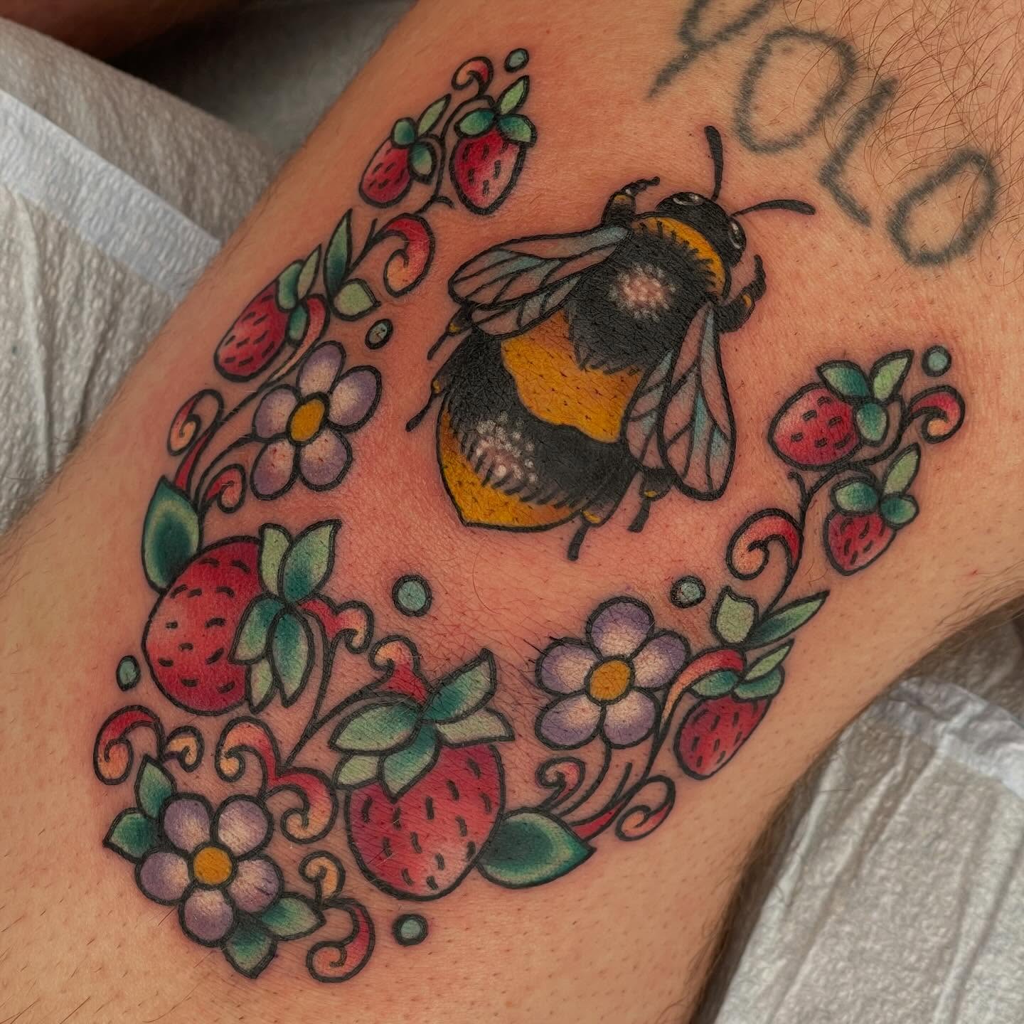 Bee and floral American traditional tattoo on the forearm by Beeker, Bellingham, Washington