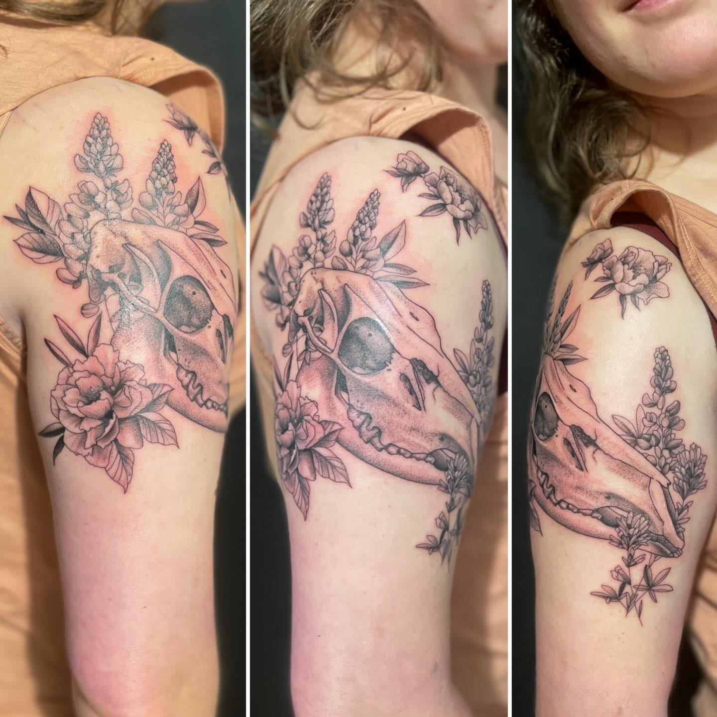 Skull and flowers black and grey tattoo on the upper arm by Linzi Hungerford, Bozeman, Montana
