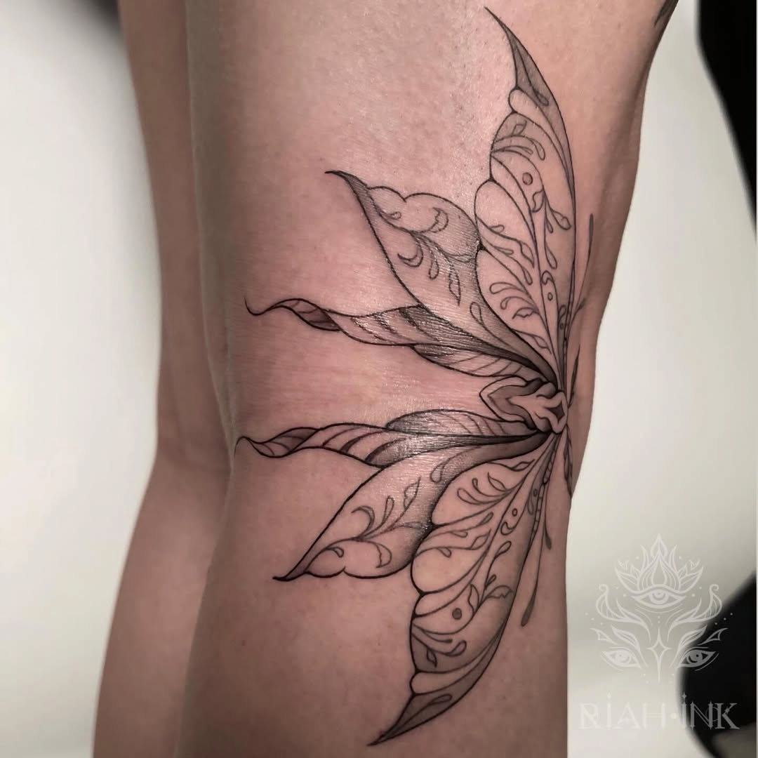 Fairy wings fine line tattoo on the forearm by Nils Bashirian