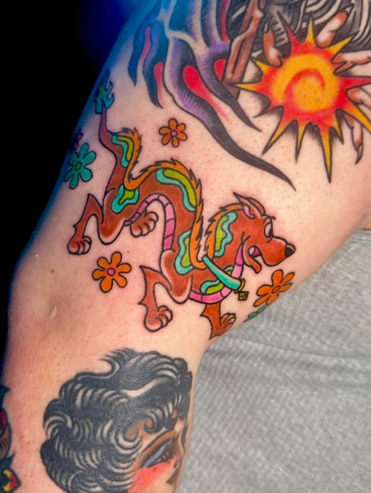 Dog and flowers new school tattoo on the forearm by ⭐️Kelvira⭐️