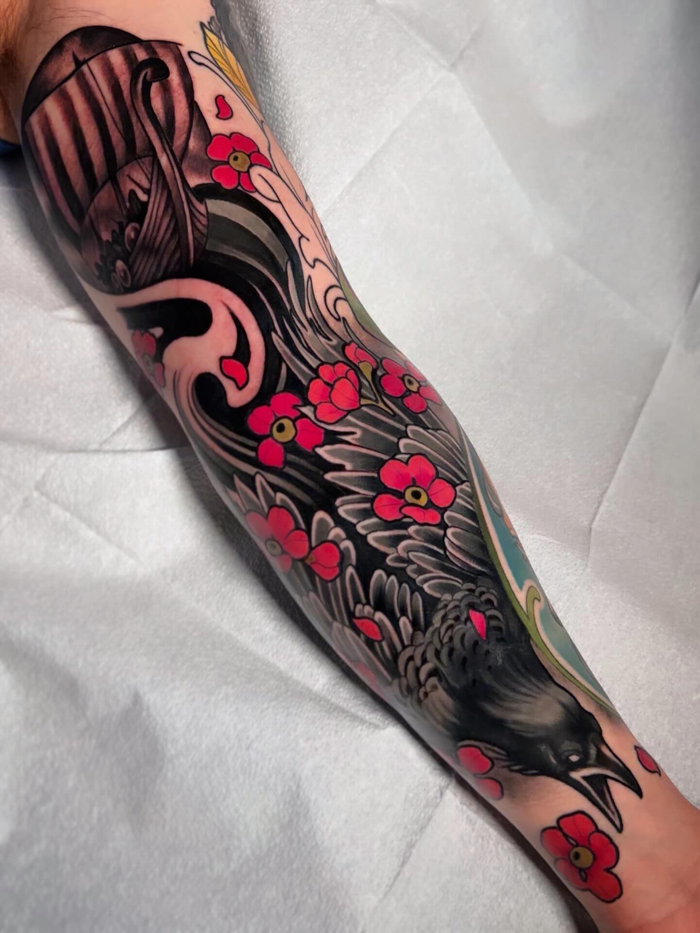 Crow and cherry blossoms japanese irezumi tattoo on the forearm by Milo Alfring Tattoo