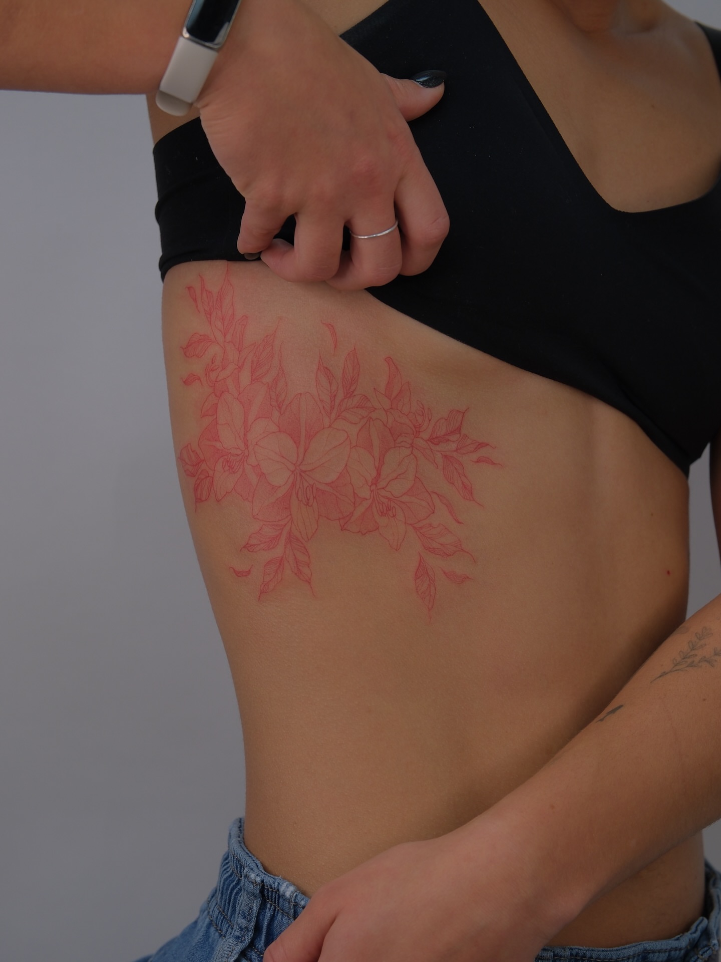 Floral arrangement fine line tattoo on the thigh by Tattoo in Charlotte NC, Charlotte, North Carolina