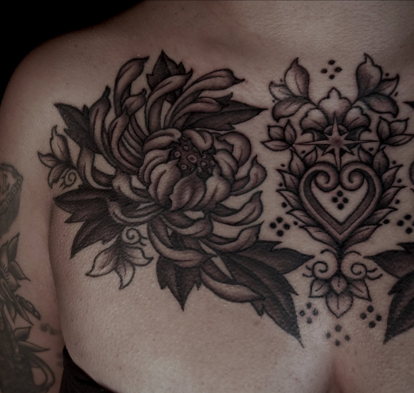 Floral bouquet dotwork tattoo on the chest by Kat McCoy Guidera, Nashville, Tennessee