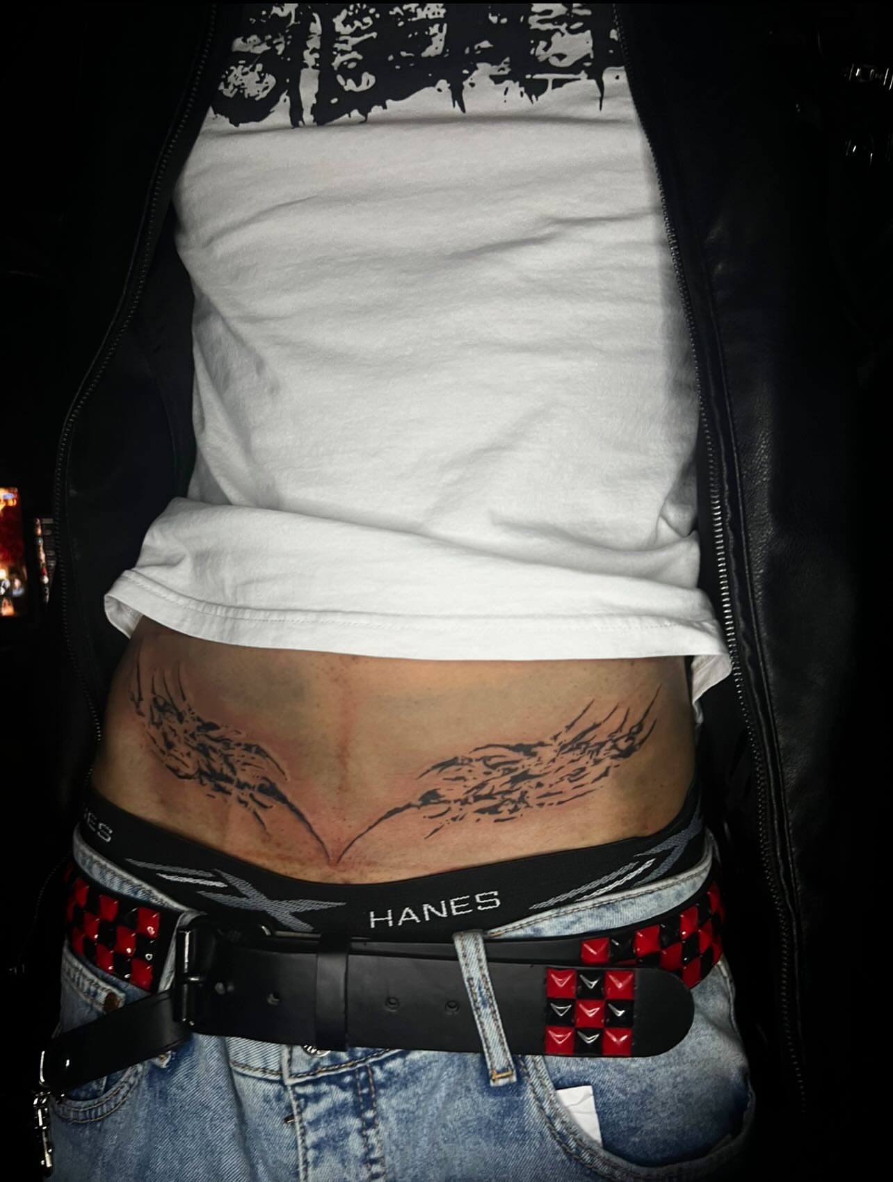 Abstract design black and grey tattoo on the torso by @halfwit__