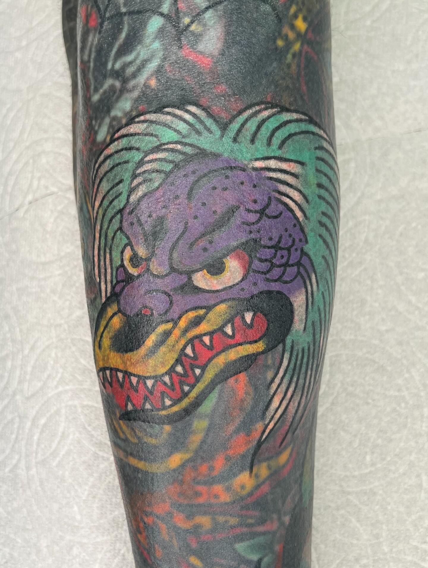 Demon head American traditional tattoo on the forearm by Mikey Montoya