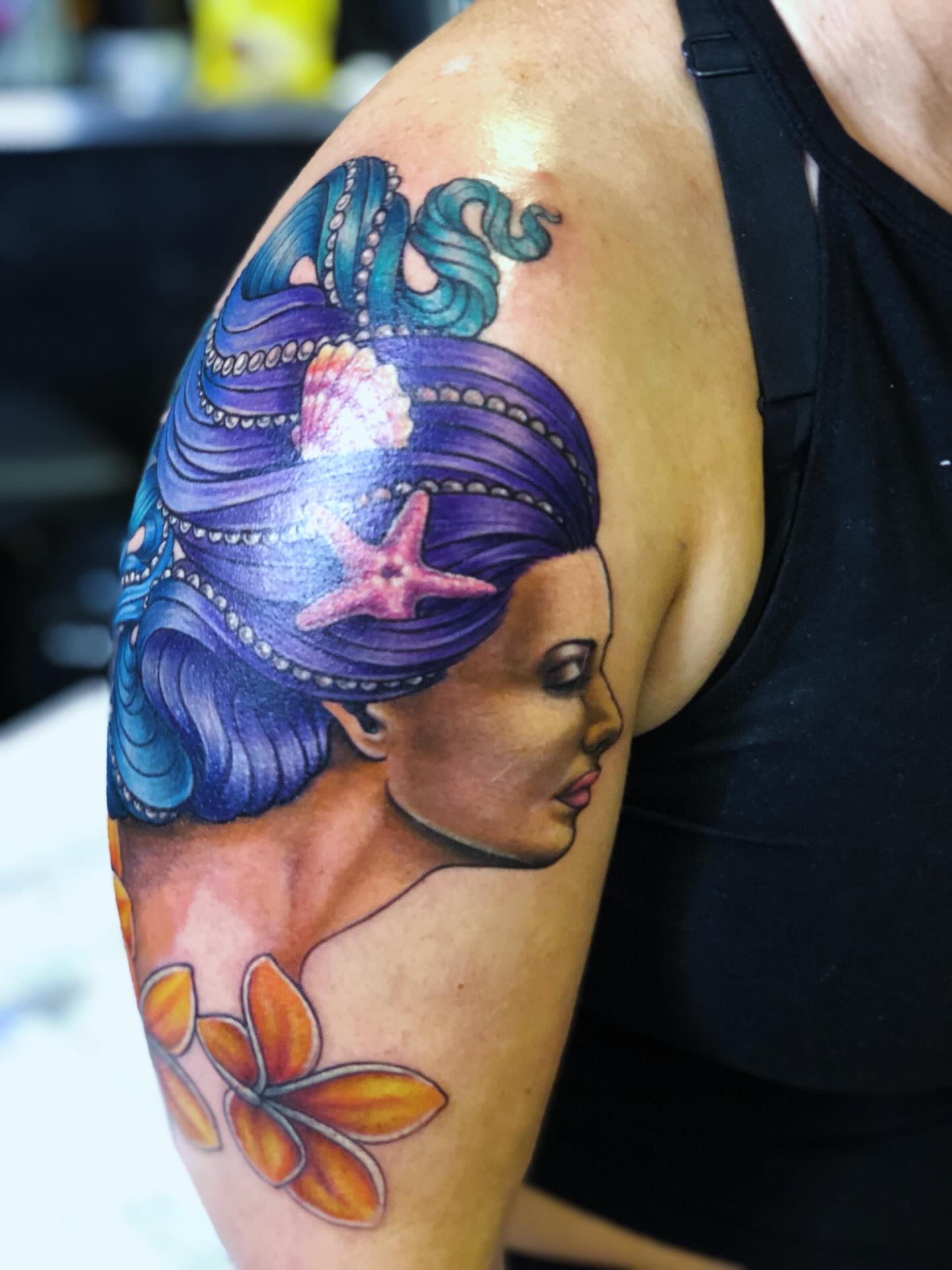 Mermaid realism tattoo on the shoulder by Teddi Bird