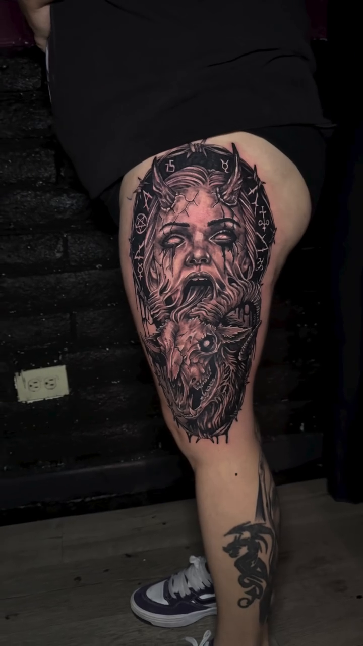 Screaming face and ram skull dark realism tattoo by Zac Pedrosa