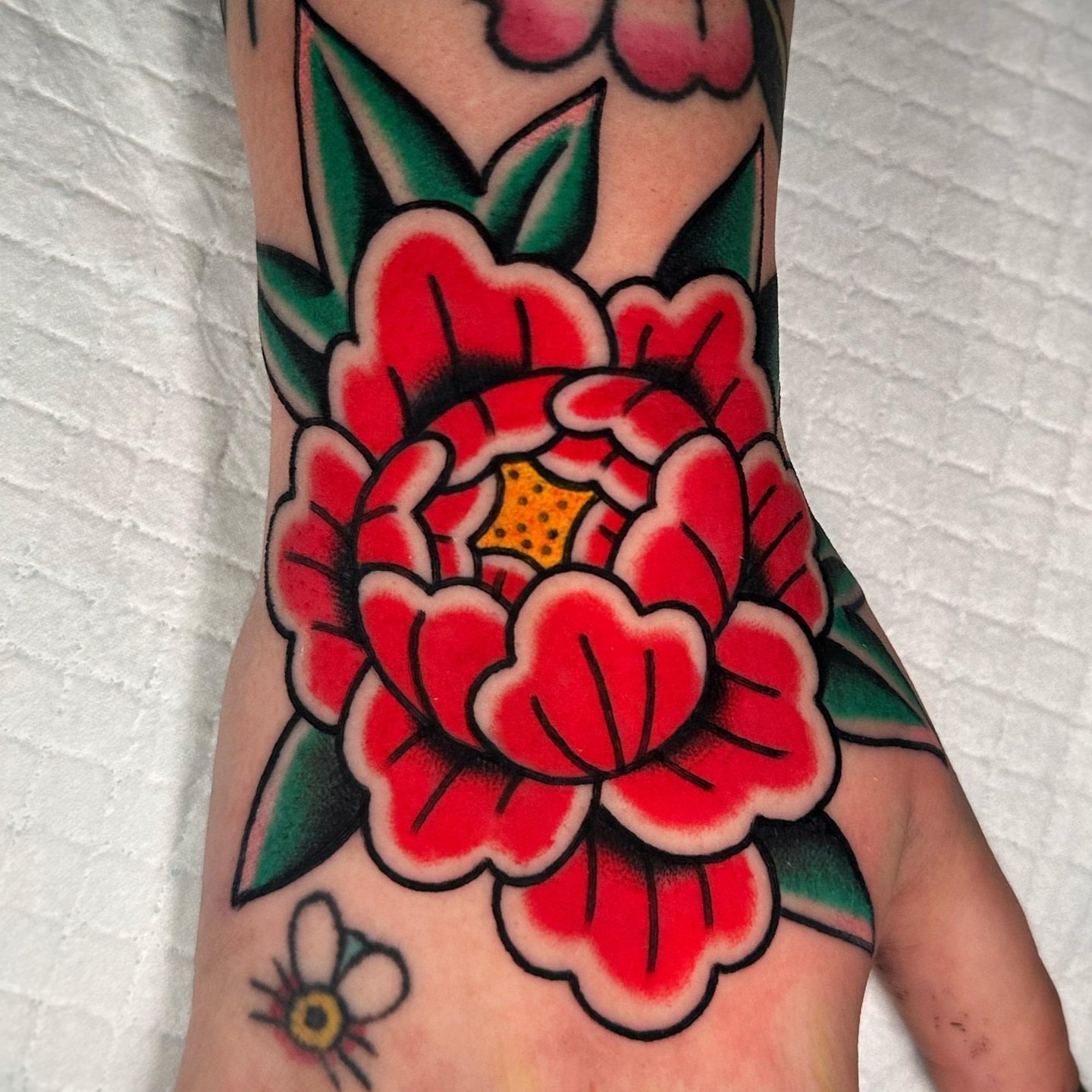 Peony American traditional tattoo on the forearm by Alex Finnerty, Reading, Massachusetts