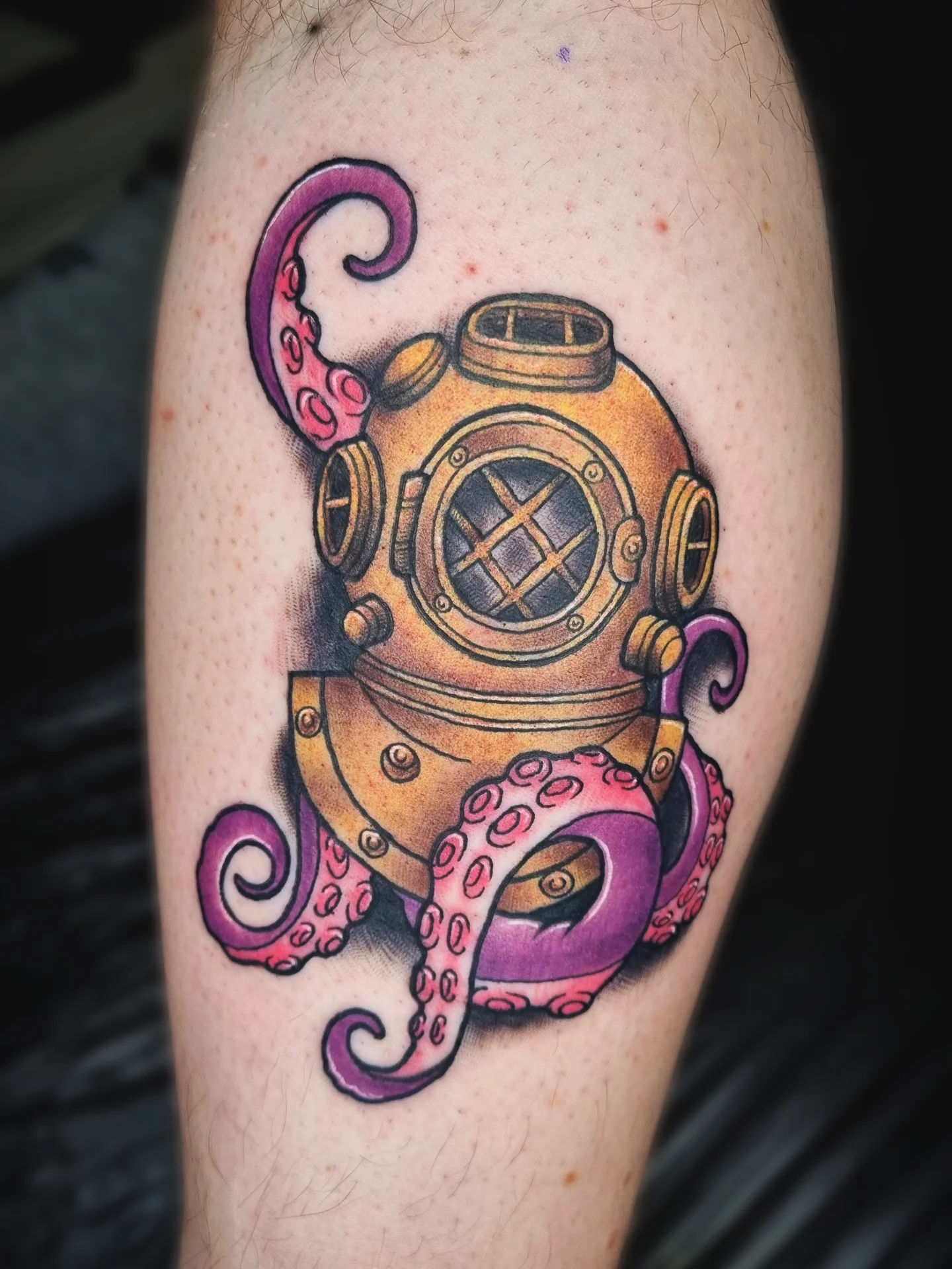 Diving helmet and octopus American traditional tattoo on the forearm by AntiheroTattoo