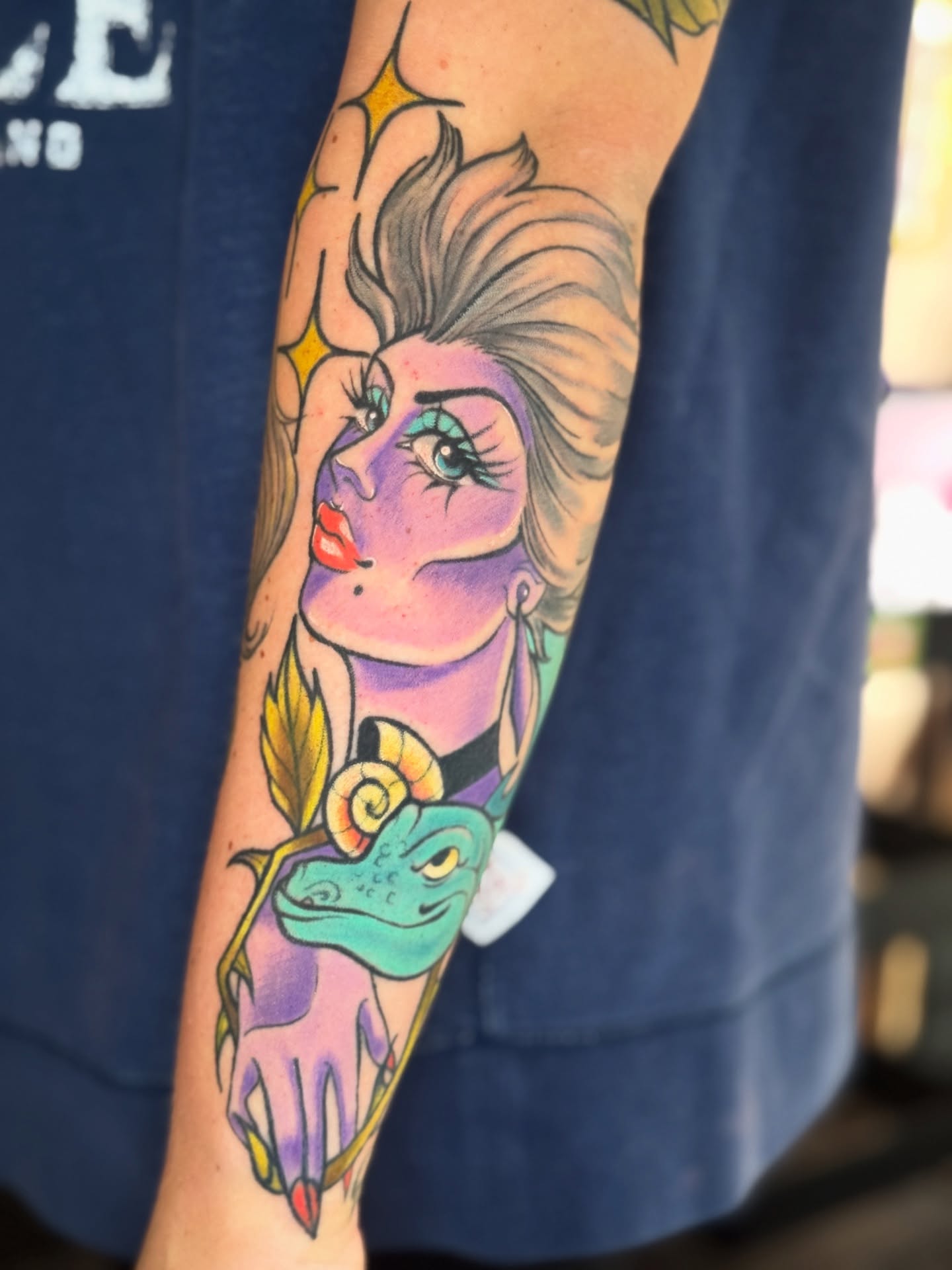 Woman with frog illustrative tattoo on the forearm by ⓒⓨⓡⓤⓢ