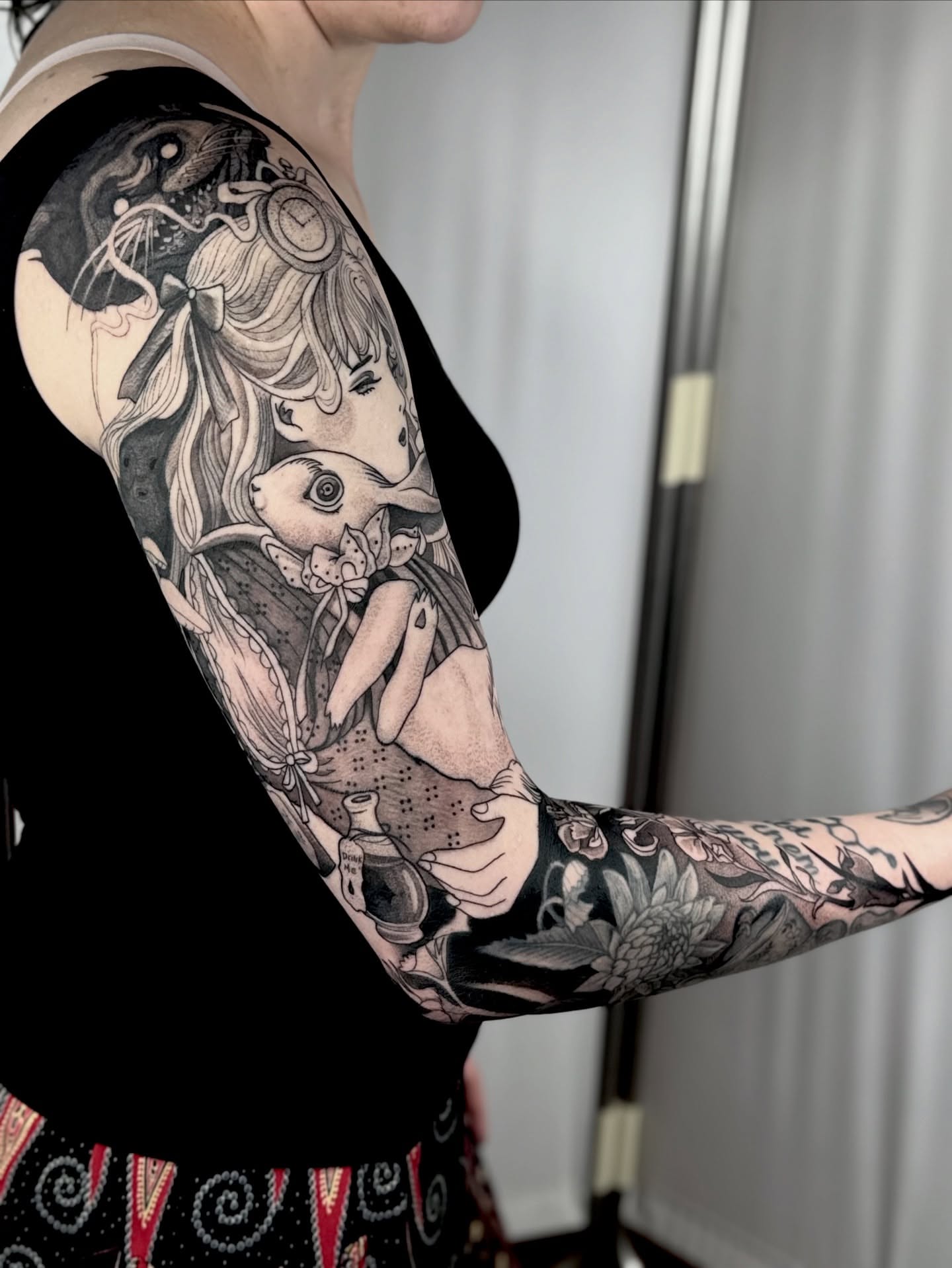 Girl with rabbit realism tattoo on the forearm by Erick Mendivil