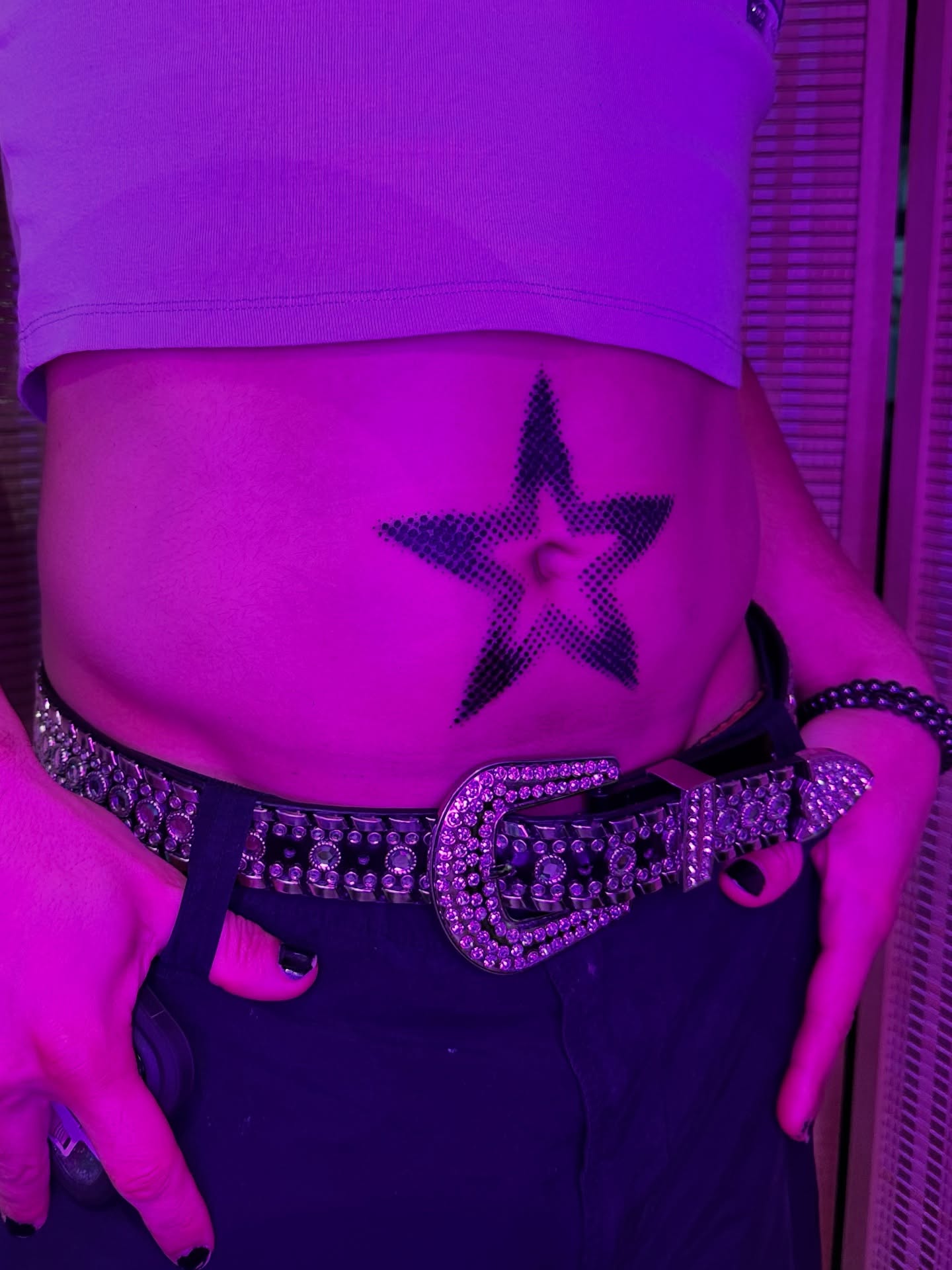 Star dotwork tattoo on the torso by father