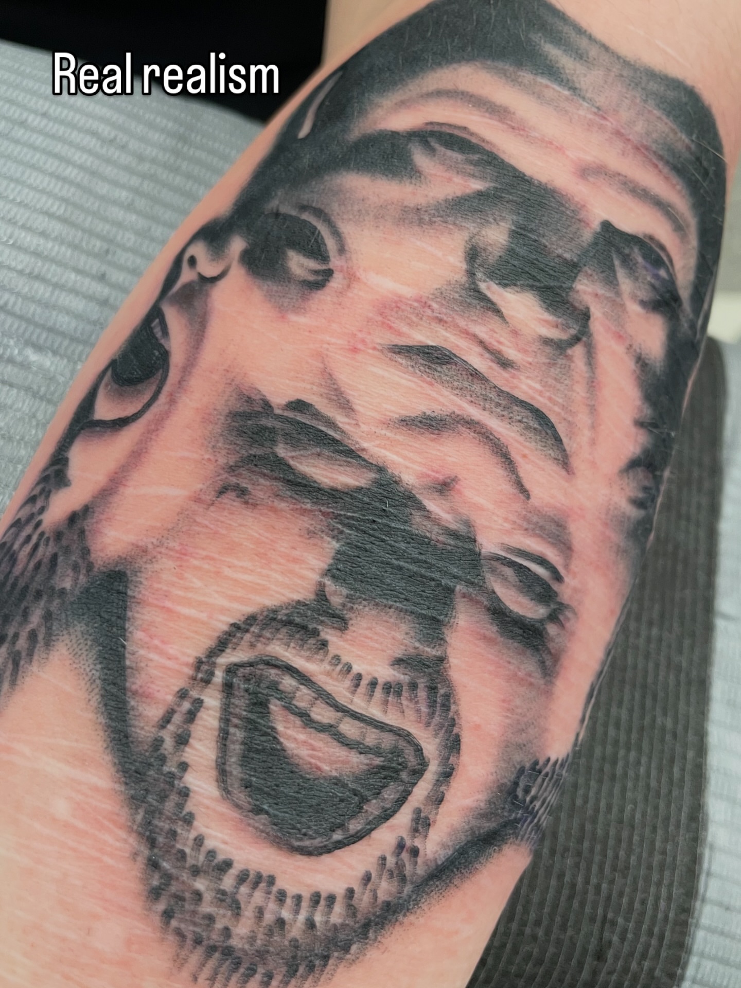 Portrait realism tattoo on the forearm by matt nelson