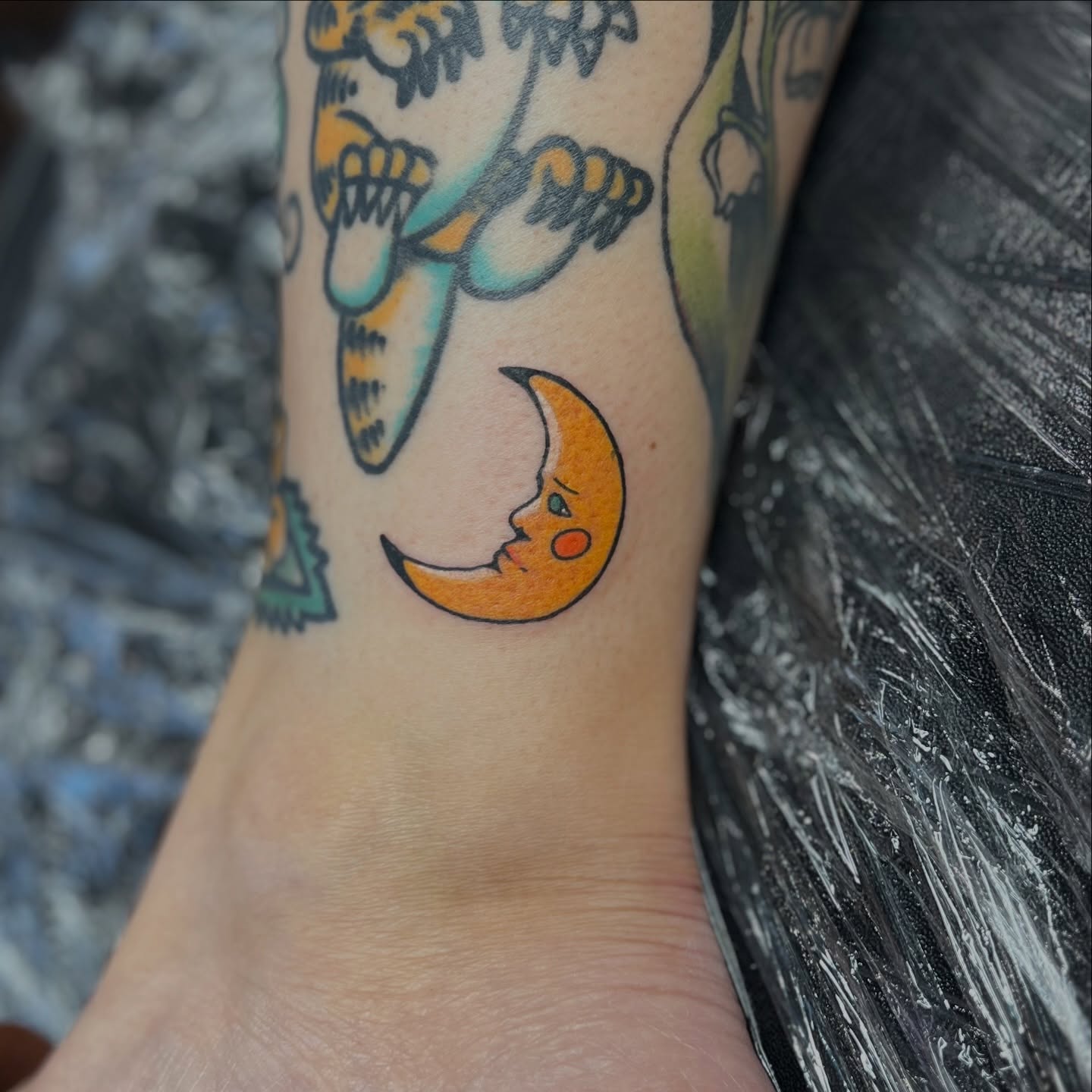Moon with face American traditional tattoo on the forearm by 𝗕𝗿𝗮𝗻𝗱𝘆  𝗪𝗼𝗼𝗱𝗳𝗼𝗿𝗱