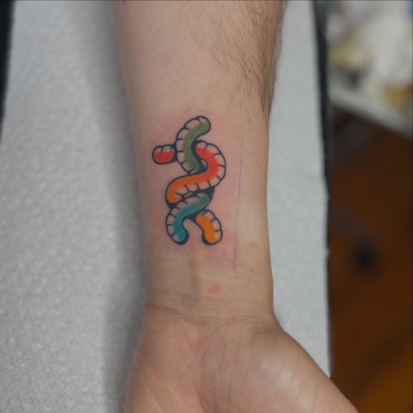 Worm-like creature new school tattoo on the forearm by 𝗕𝗿𝗮𝗻𝗱𝘆  𝗪𝗼𝗼𝗱𝗳𝗼𝗿𝗱