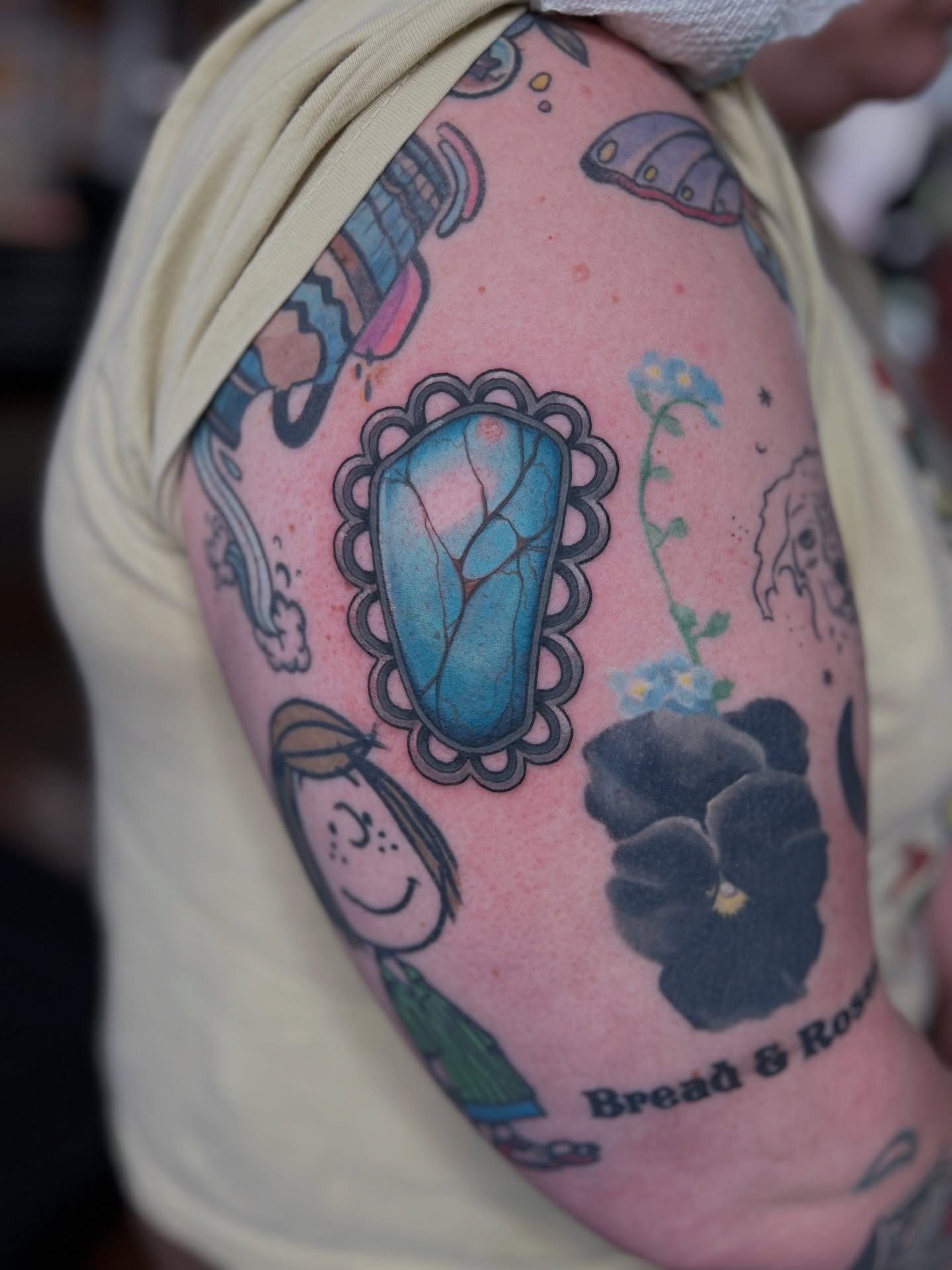 Blue stone neo-traditional tattoo on the shoulder by 𝗕𝗿𝗮𝗻𝗱𝘆  𝗪𝗼𝗼𝗱𝗳𝗼𝗿𝗱