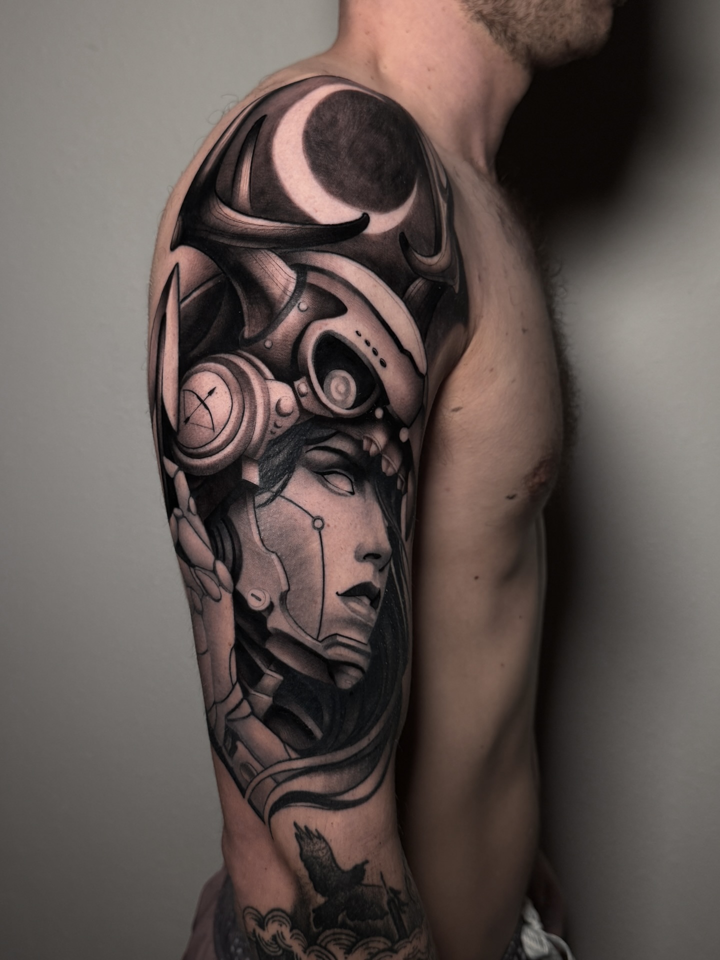 Mechanical woman realism tattoo on the upper arm by Carlos Valdes ✨ Tattoo Artist in Tampa FL