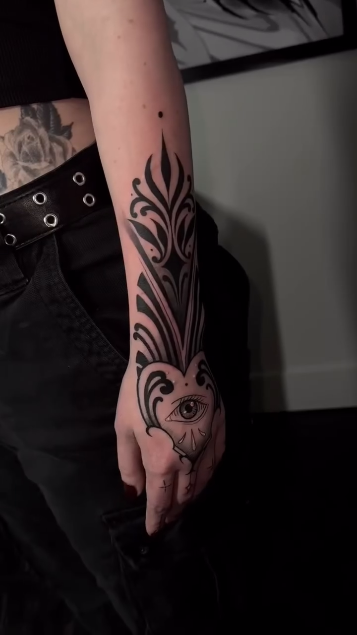 Eye and abstract design ornamental tattoo by Turk