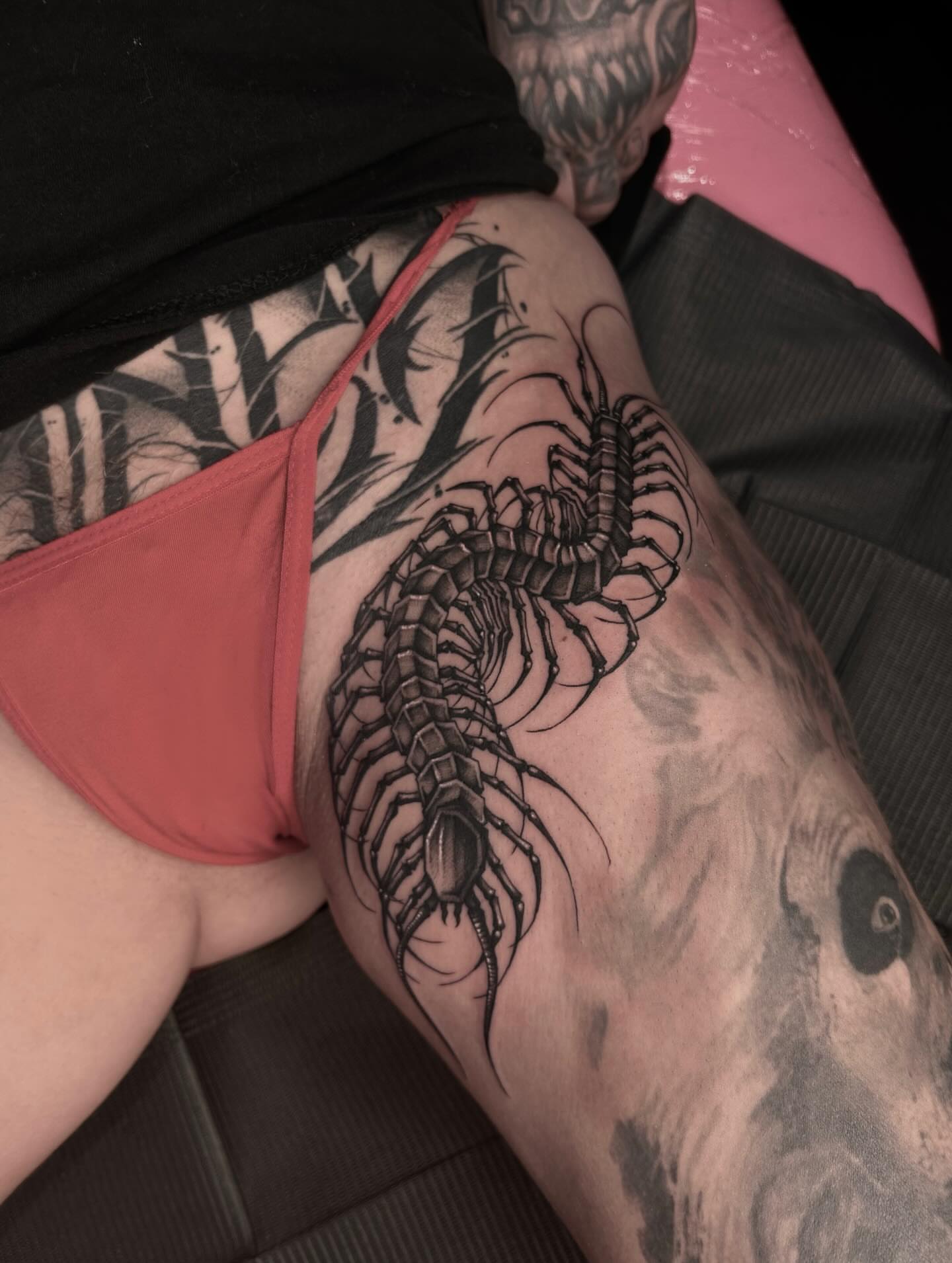 Centipede black and grey tattoo on the thigh by Tattoos by Abbey