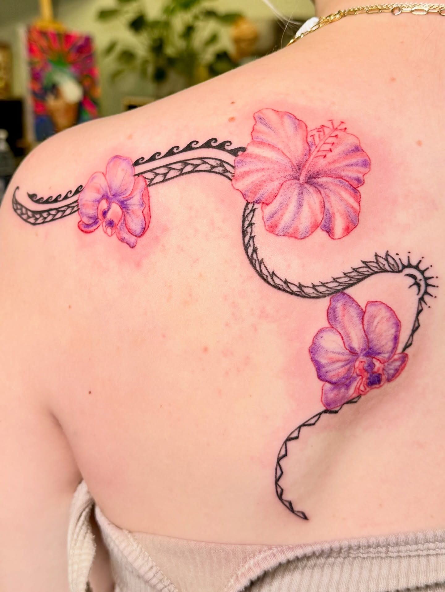 Hawaiian flowers and rope watercolor tattoo on the shoulder by Healoha “Lindelle” Kamanu