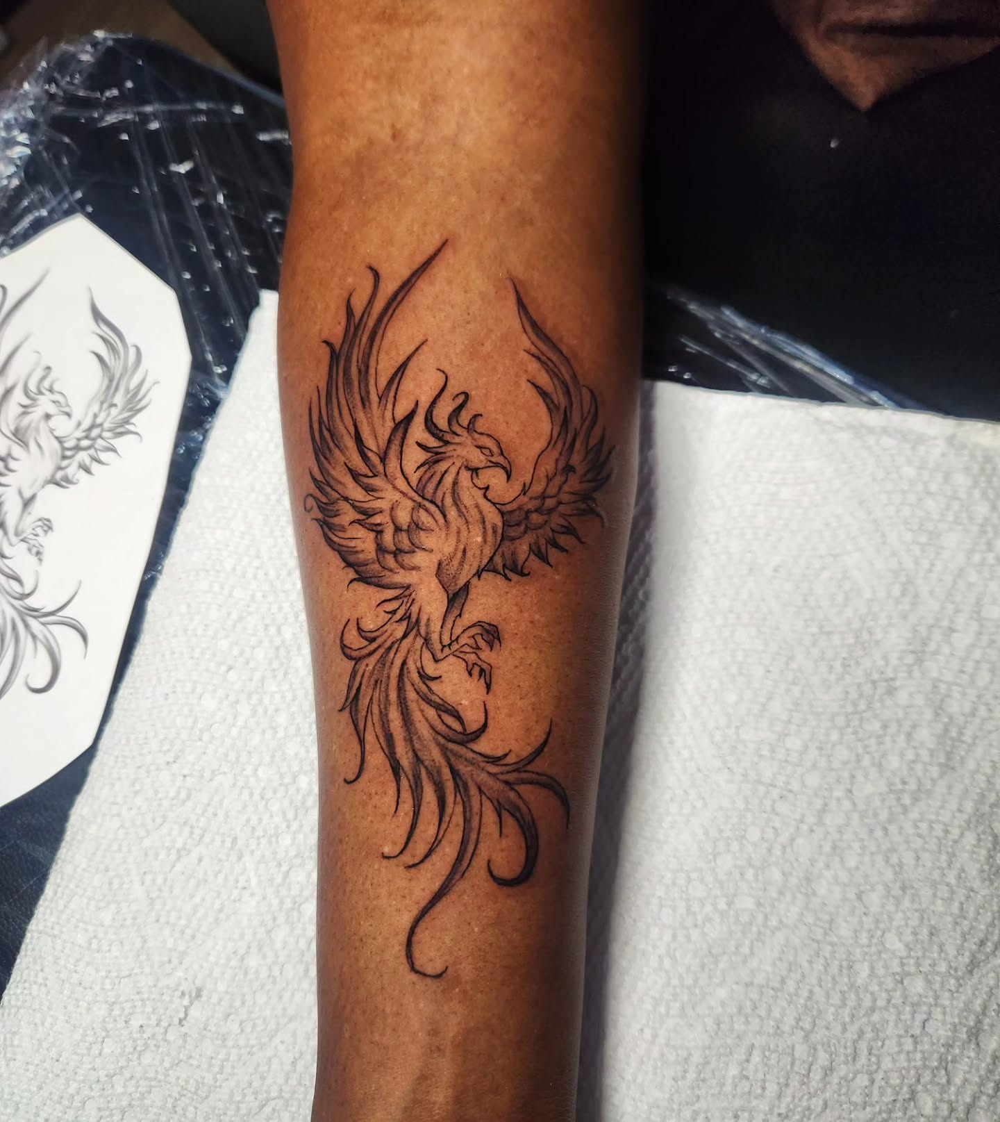Phoenix black and grey tattoo on the forearm by Abby Renteria