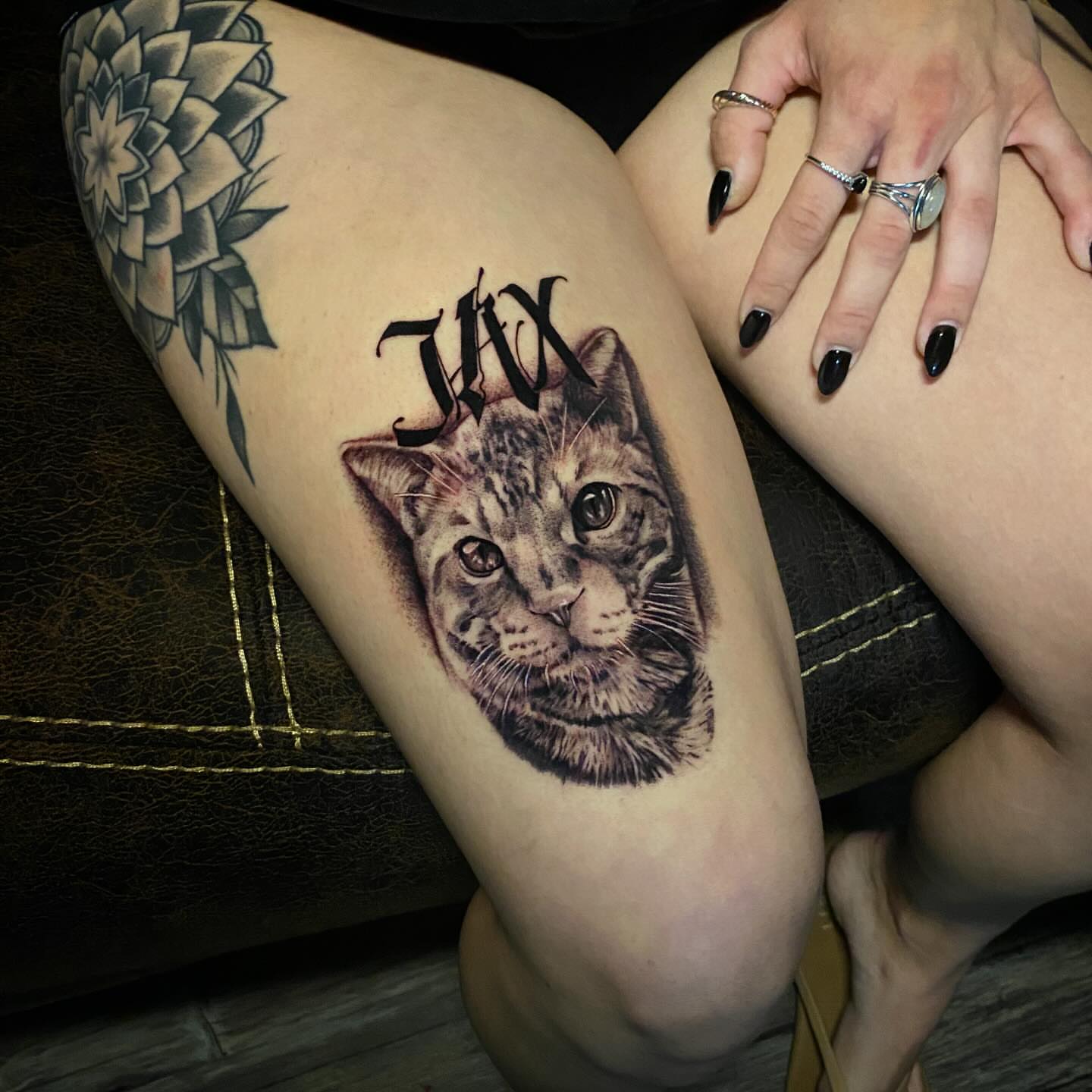 Cat realism tattoo on the thigh by Marky