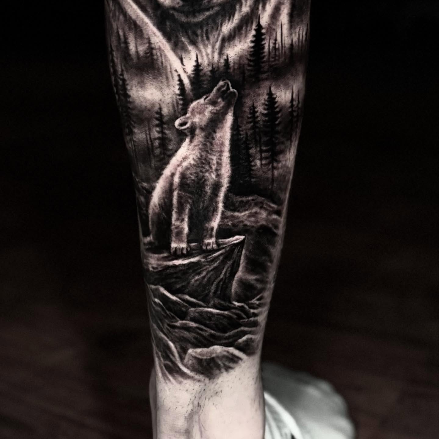 Bear howling realism tattoo on the forearm by Jeremiah Warner