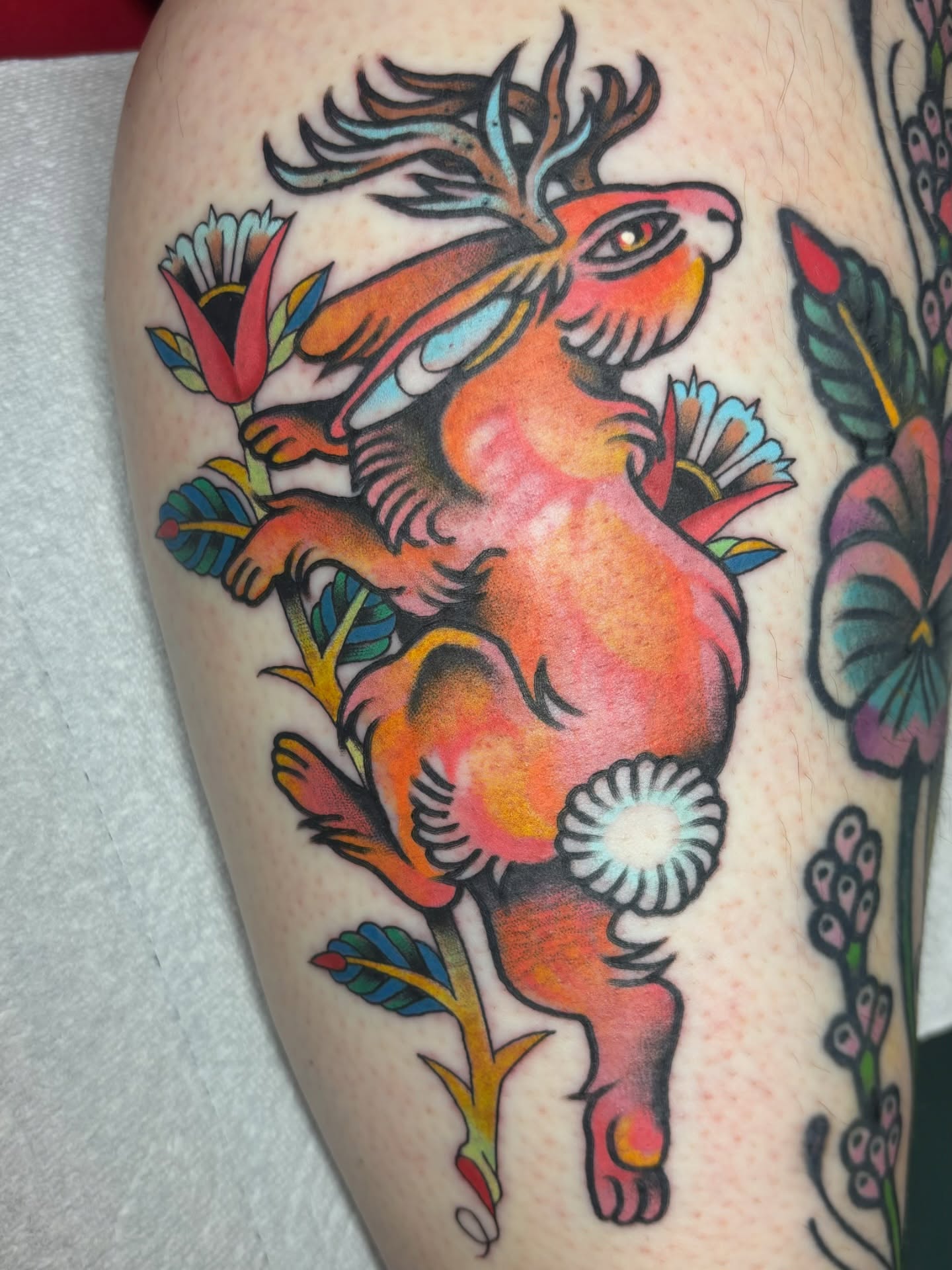 Deer and flowers American traditional tattoo on the thigh by edith🌷, Murfreesboro, Tennessee