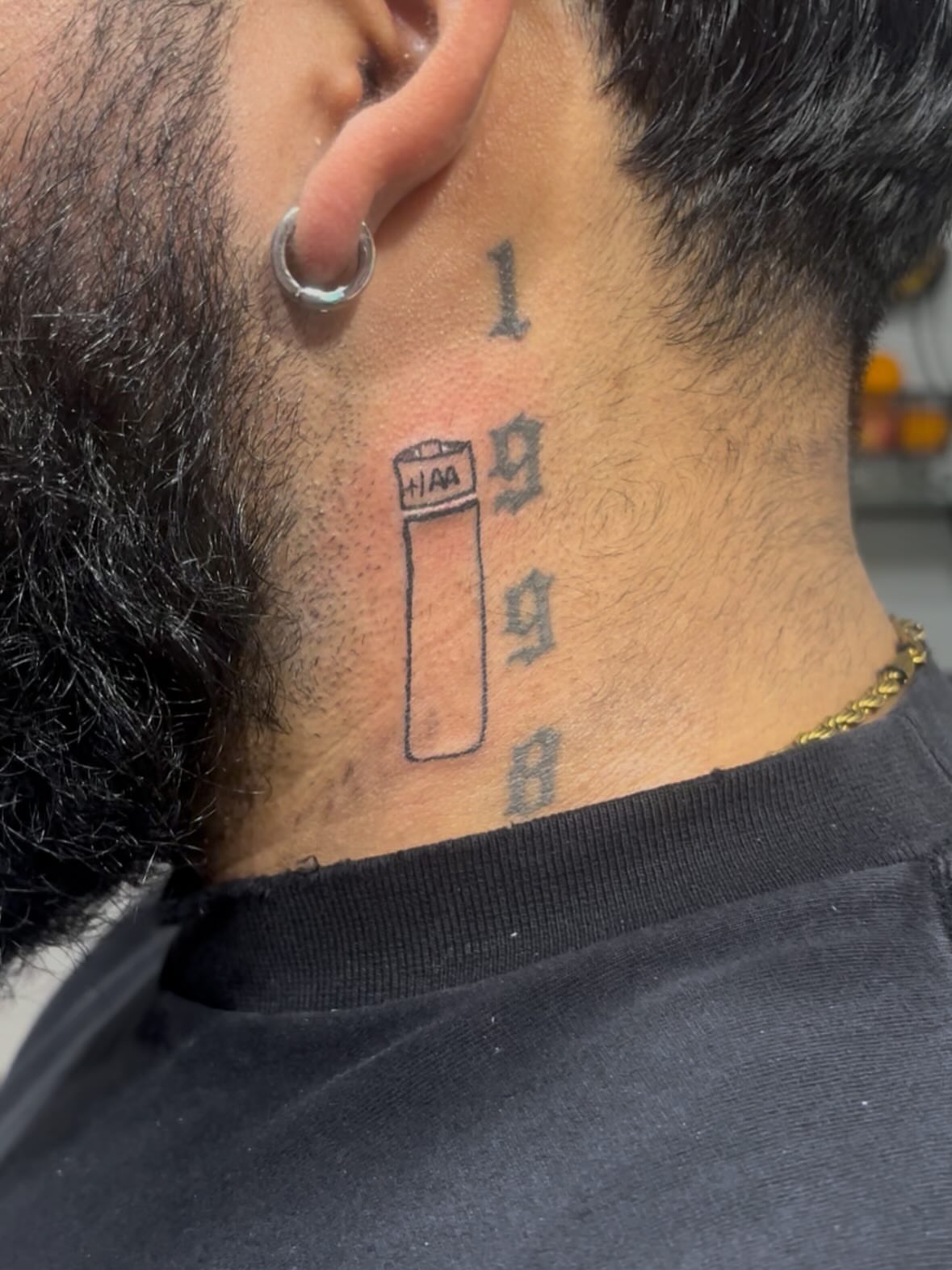 Battery and numbers lettering script tattoo on the neck by Ana Uriarte π