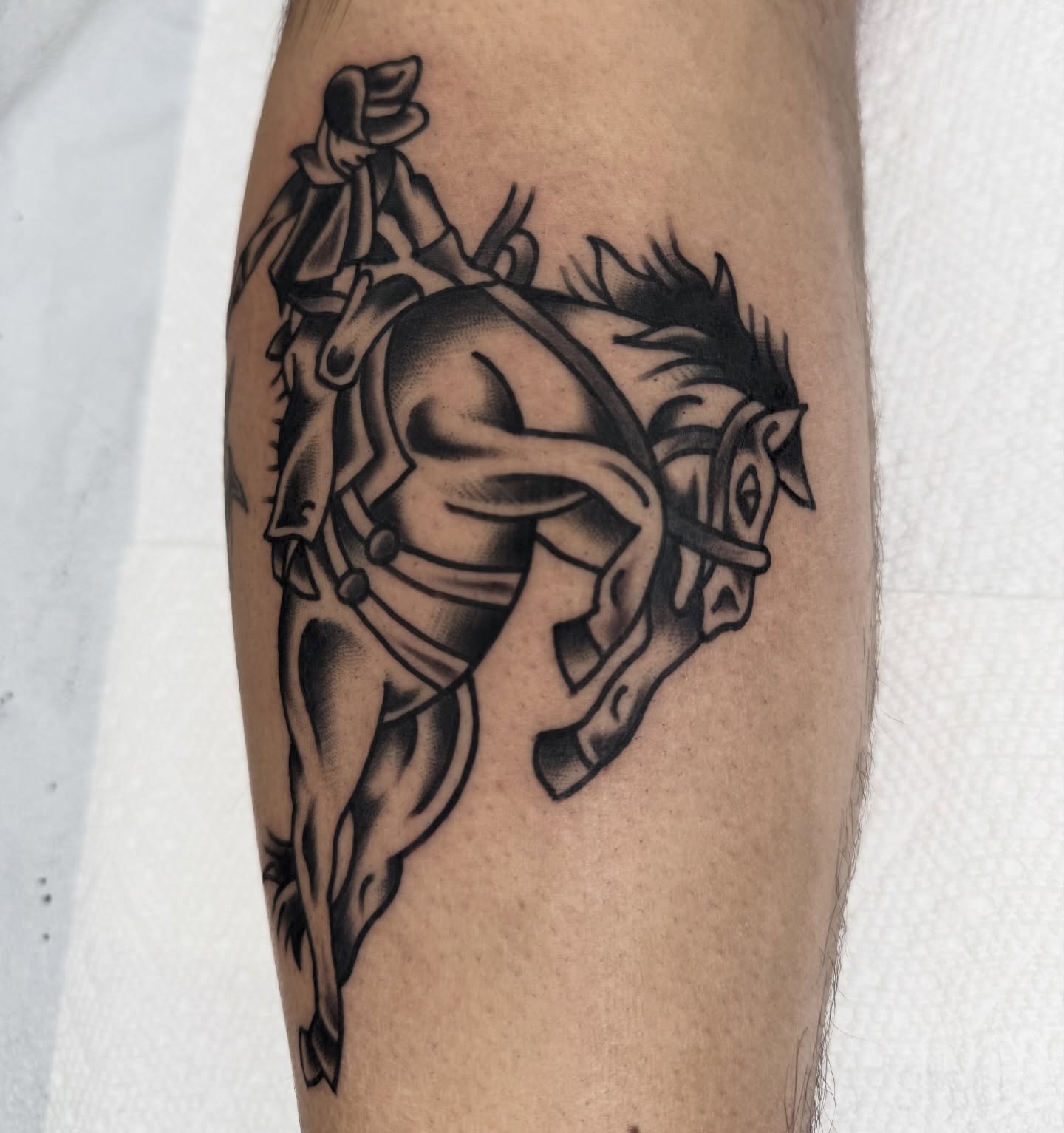 Cowboy riding horse American traditional tattoo on the forearm by Drew🕸️, Phoenix, Arizona