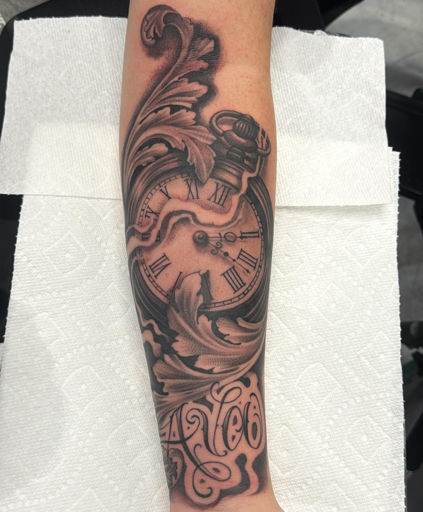 Clock and floral realism tattoo on the forearm by @nickysix86