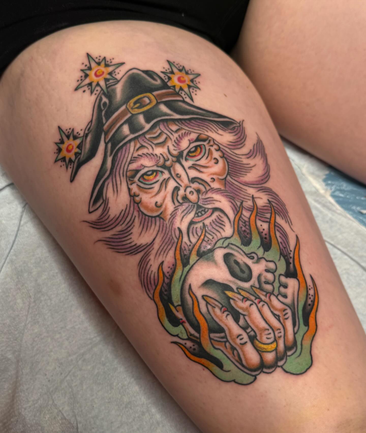 Wizard and skull American traditional tattoo on the thigh by B