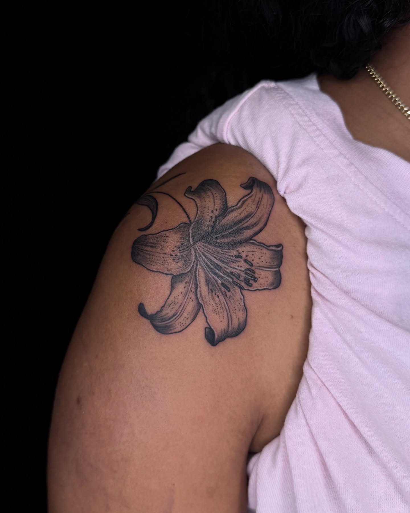 Lily black and grey tattoo on the shoulder by Too Zen