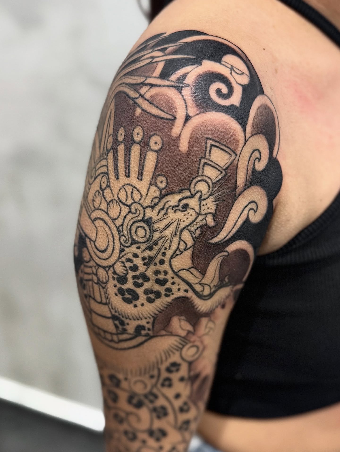 Jaguar and warrior tribal tattoo on the shoulder by Meza Cruz