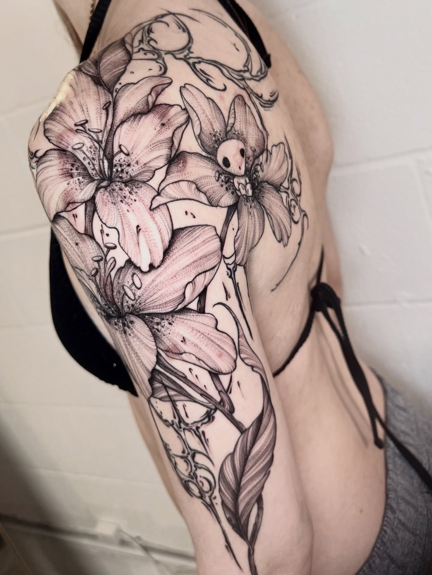 Lilies realism tattoo on the forearm by ℳ𝒾𝓇𝓉𝒽𝒶 𝒯ℴ𝓇𝓇ℯ𝓈, San Diego, California